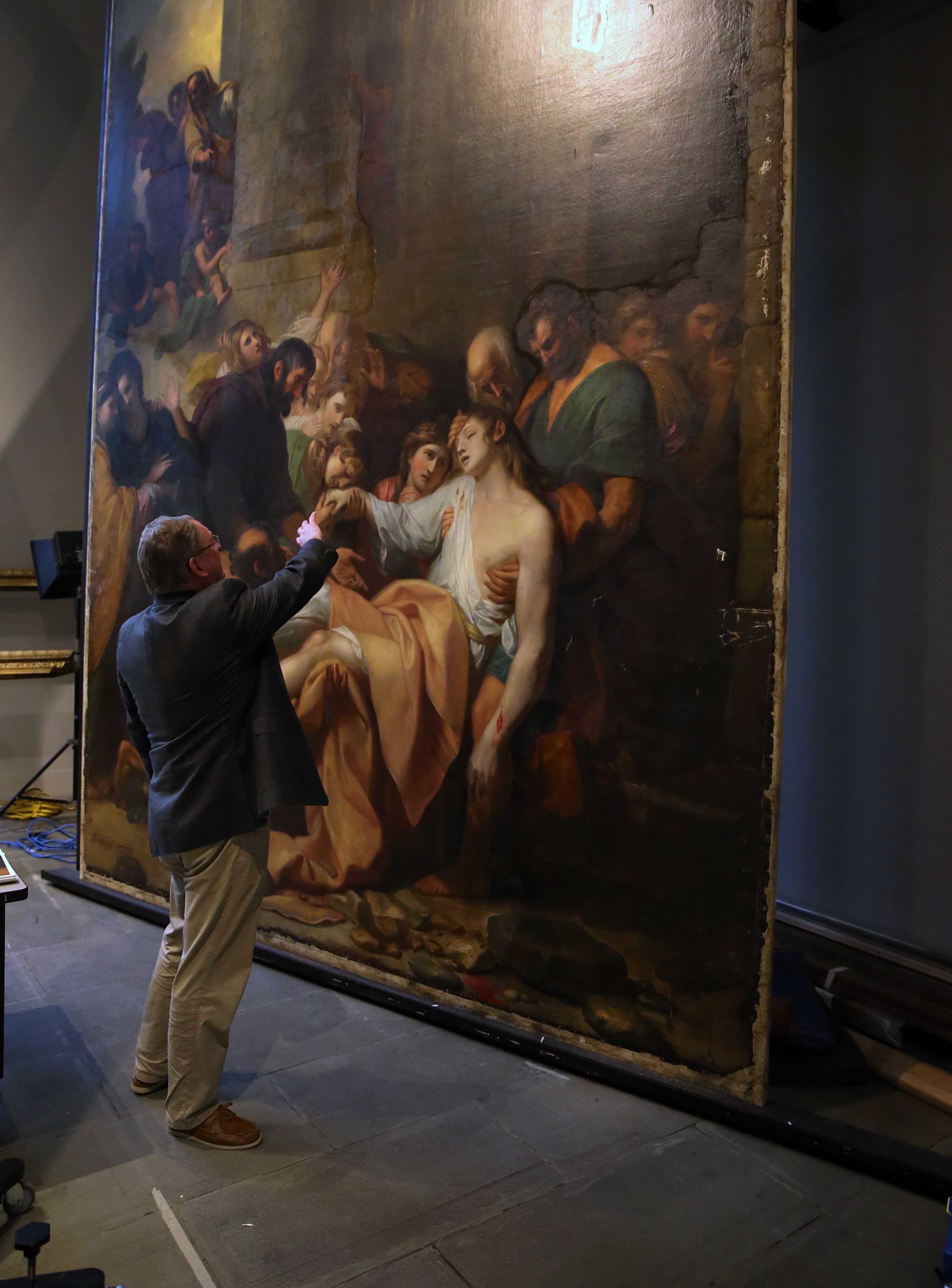 Malcolm Rogers with Benjamin West’s “Devout Men Taking the Body of Saint Stephen” at the Museum of Fine Arts.