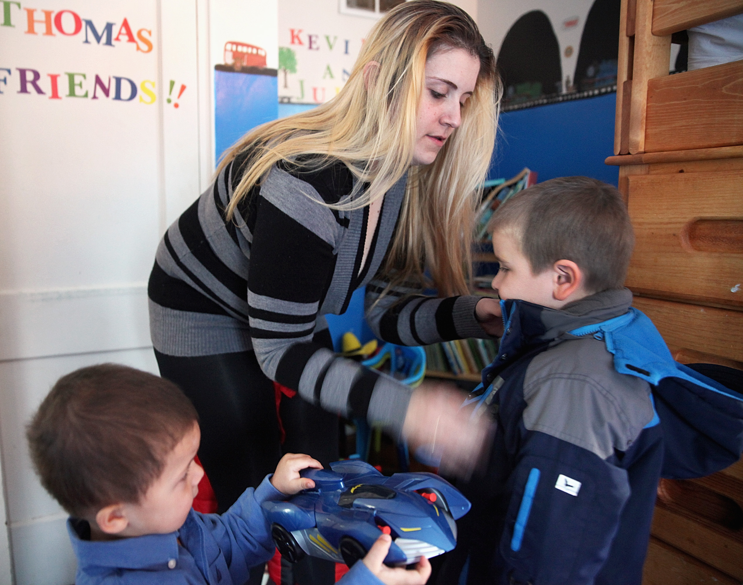 Lindsey Collins, shown with her sons Kevin, 5, and Julian, 2, in their Quincy home, lived in a series of motels