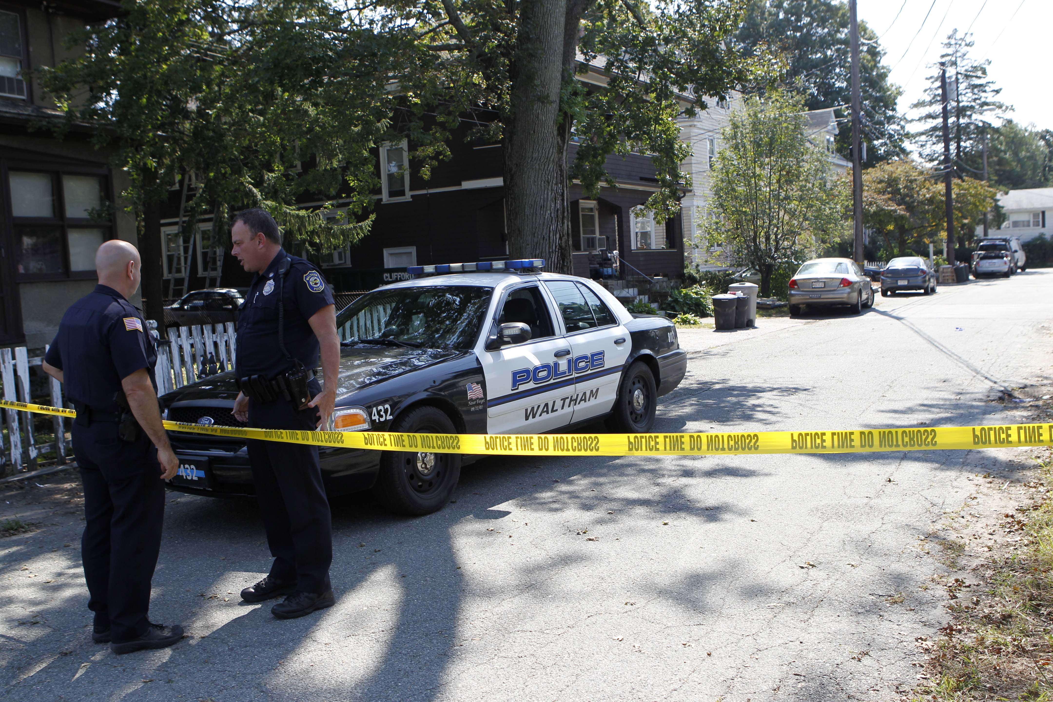Waltham police closed Harding Avenue after three men were found dead in a house in 2011.