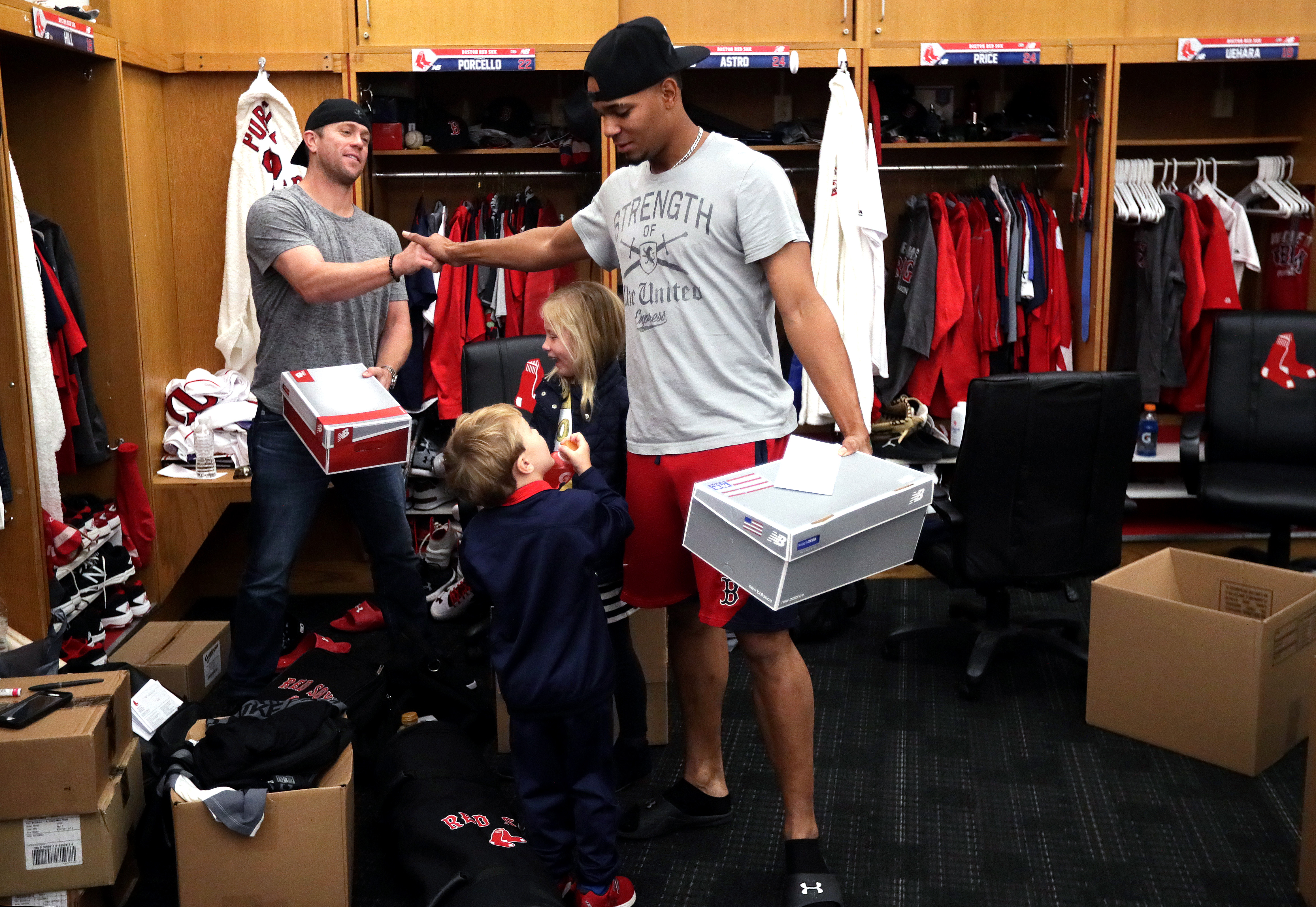 Aaron Hill (left) and Xander Bogaerts said goodbye after the Red Sox were eliminated from the playoffs.