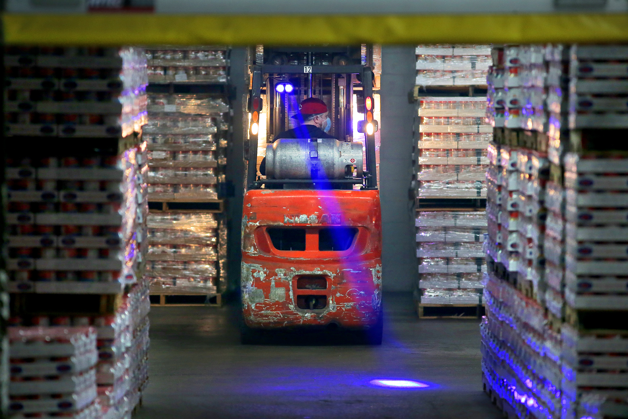 Pallets of peanut butter were loaded onto trucks at the Teddie peanut butter facility in Everett. Peanut butter is in high demand during the pandemic.