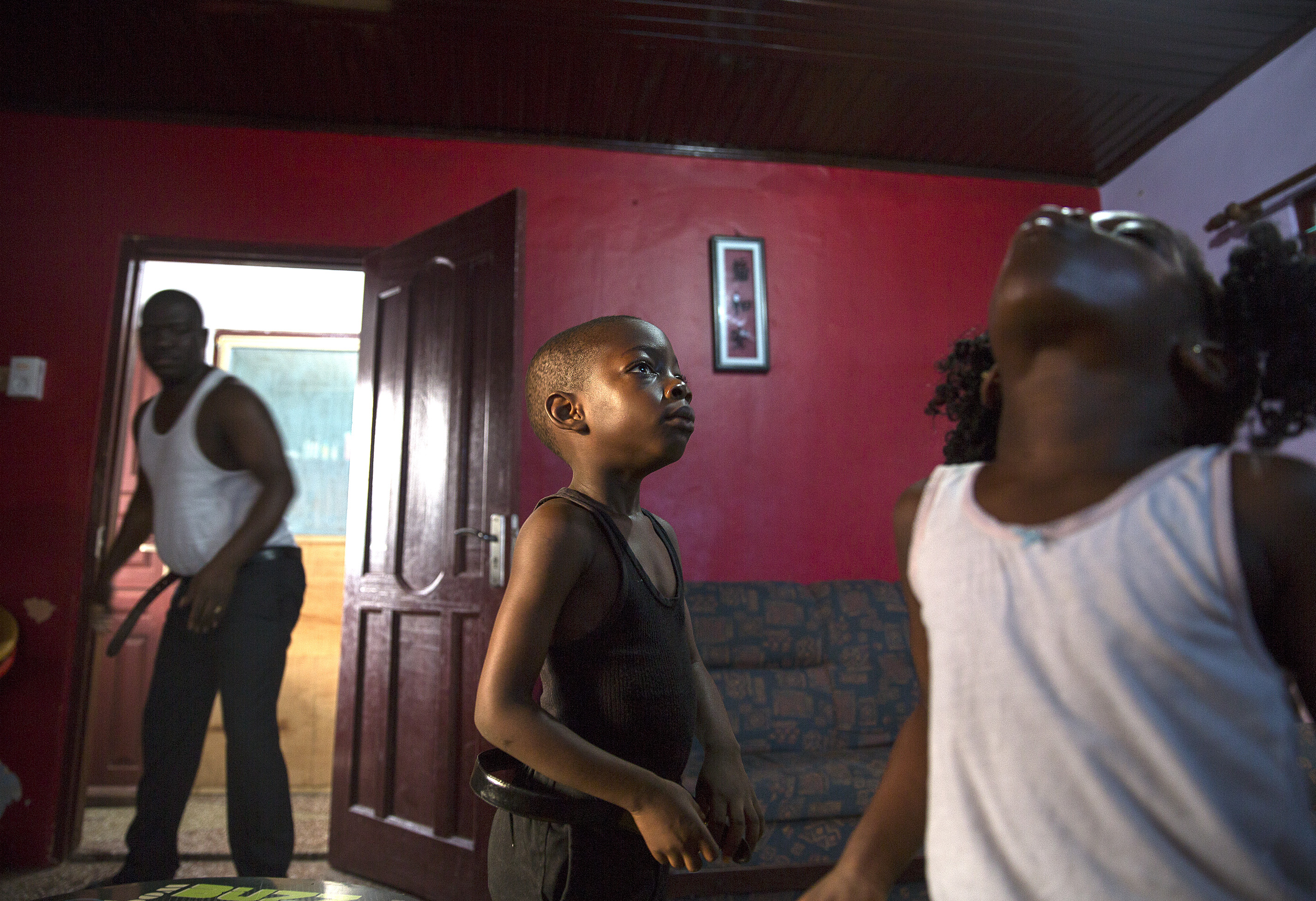 Owusu’s children, Yaw (center) and Yaa, gargled with mouthwash, part of their morning routine, as their father, William Yaw Owusu, got ready for work. He is the deputy editor of the Daily Guide, a widely read private newspaper in Ghana.
