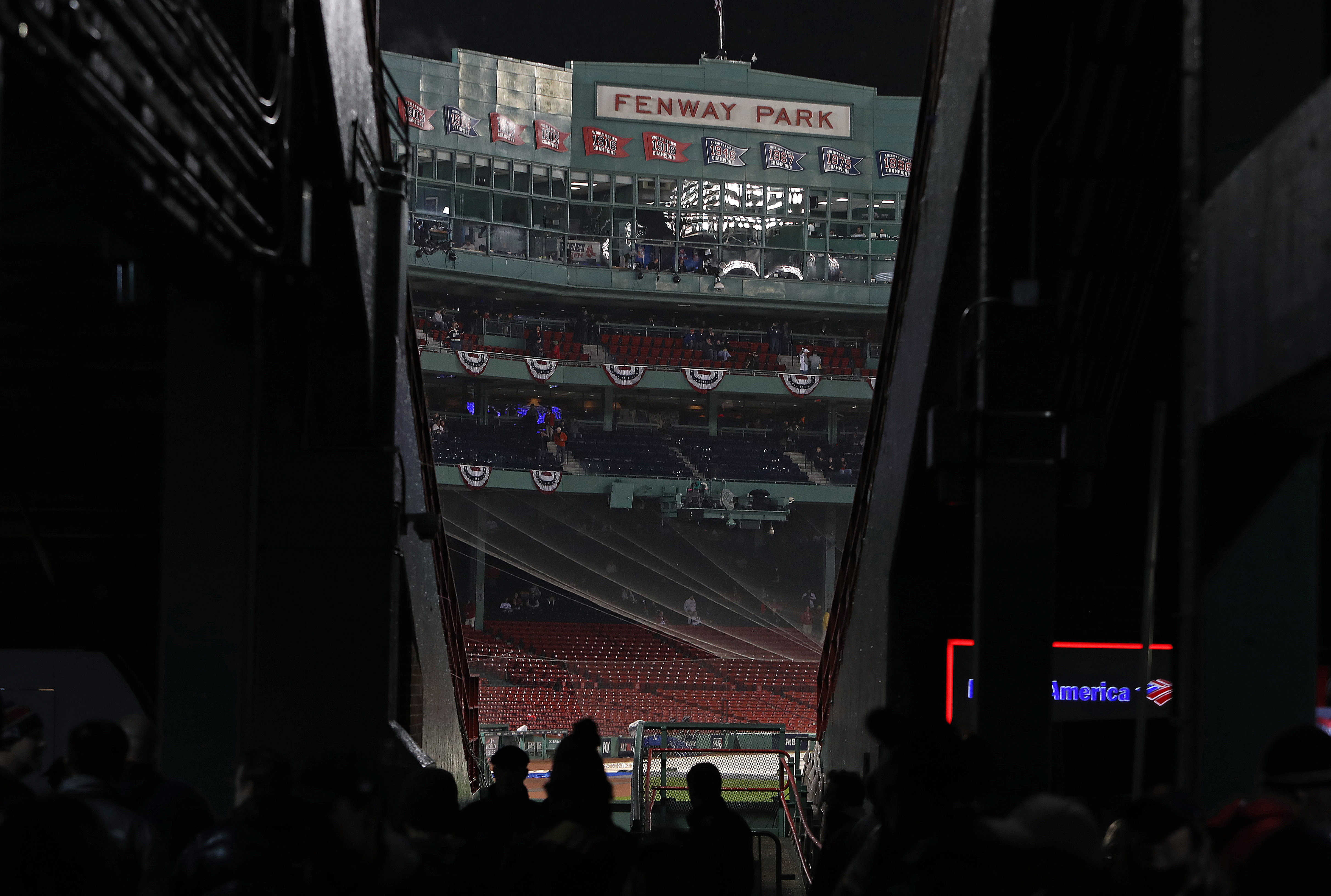 Fans were instructed to take cover as a storm moved through the area.