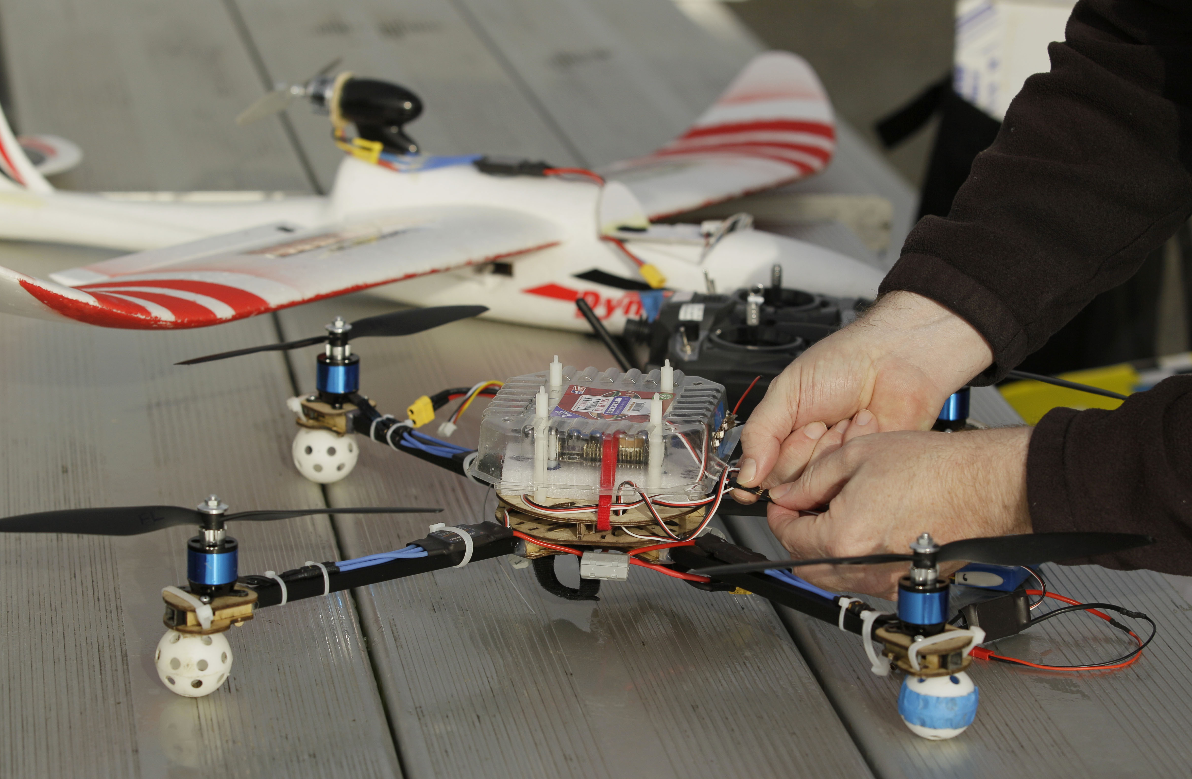 Mark Harrison prepared his drone for a flight over a Berkeley, Calif., park. New rules for drone use are coming soon.