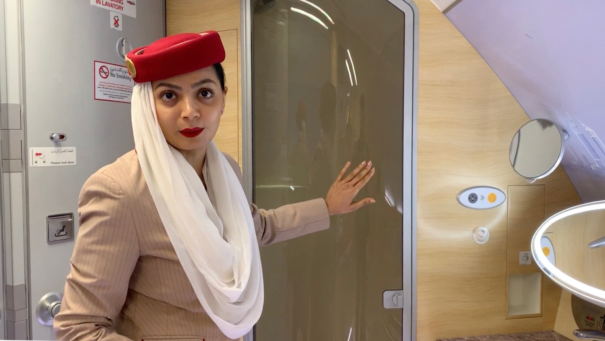 Kavitha Madanraj demonstrates the features of the spa on board an Emirates A380 flight from Dubai to Boston.