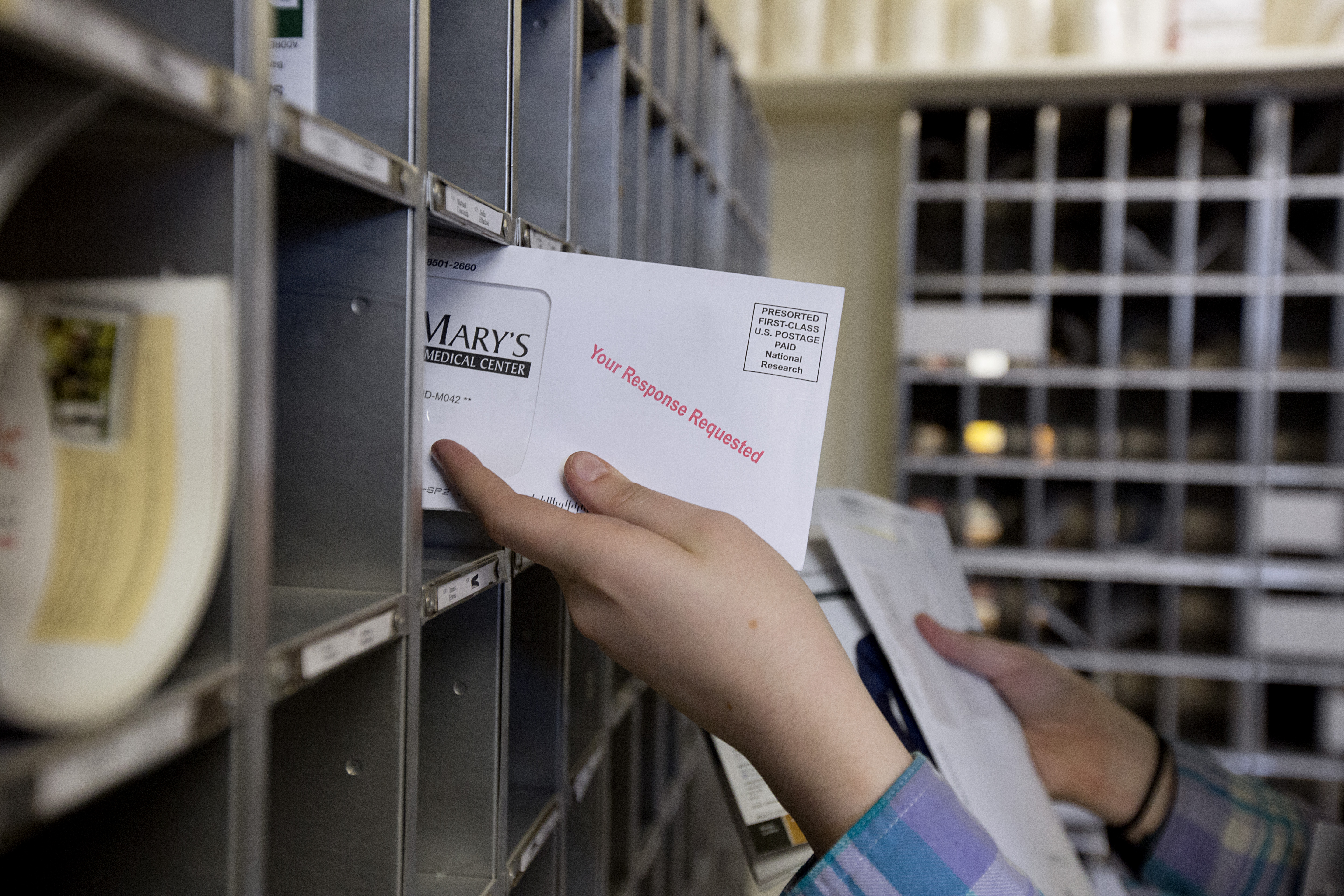 Chandler Ryan, 18, a first year student worker from Delmar, N.Y., delivered student mail to their appropriate mailboxes in the mailroom.