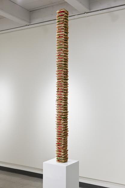 Artist Justin Richel will create a smaller version of his sandwich sculpture, “Tall Order,” for the winner of an auction at MassArt on Saturday.