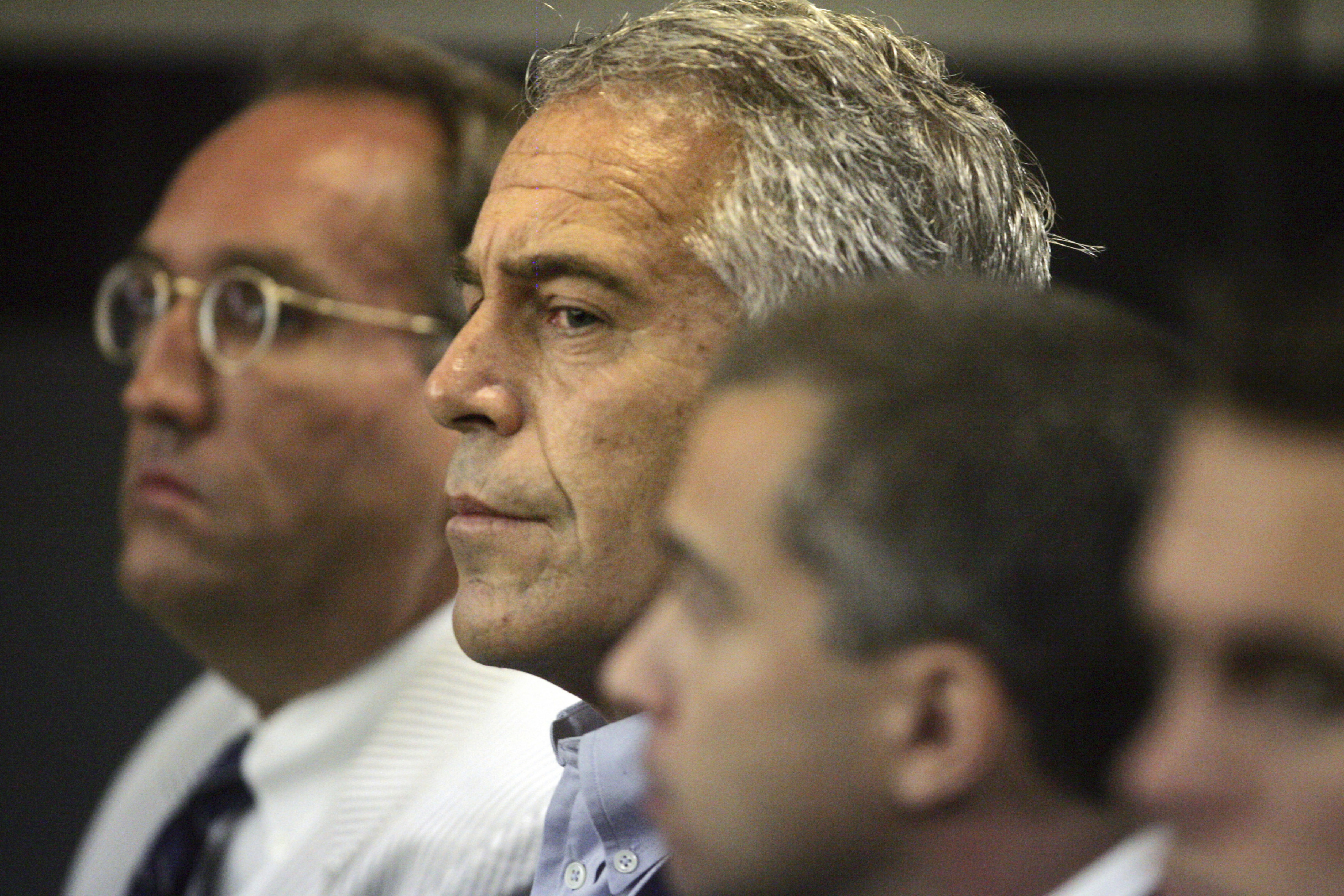 Jeffrey Epstein (center) appeared in court in West Palm Beach, Fla. in August.