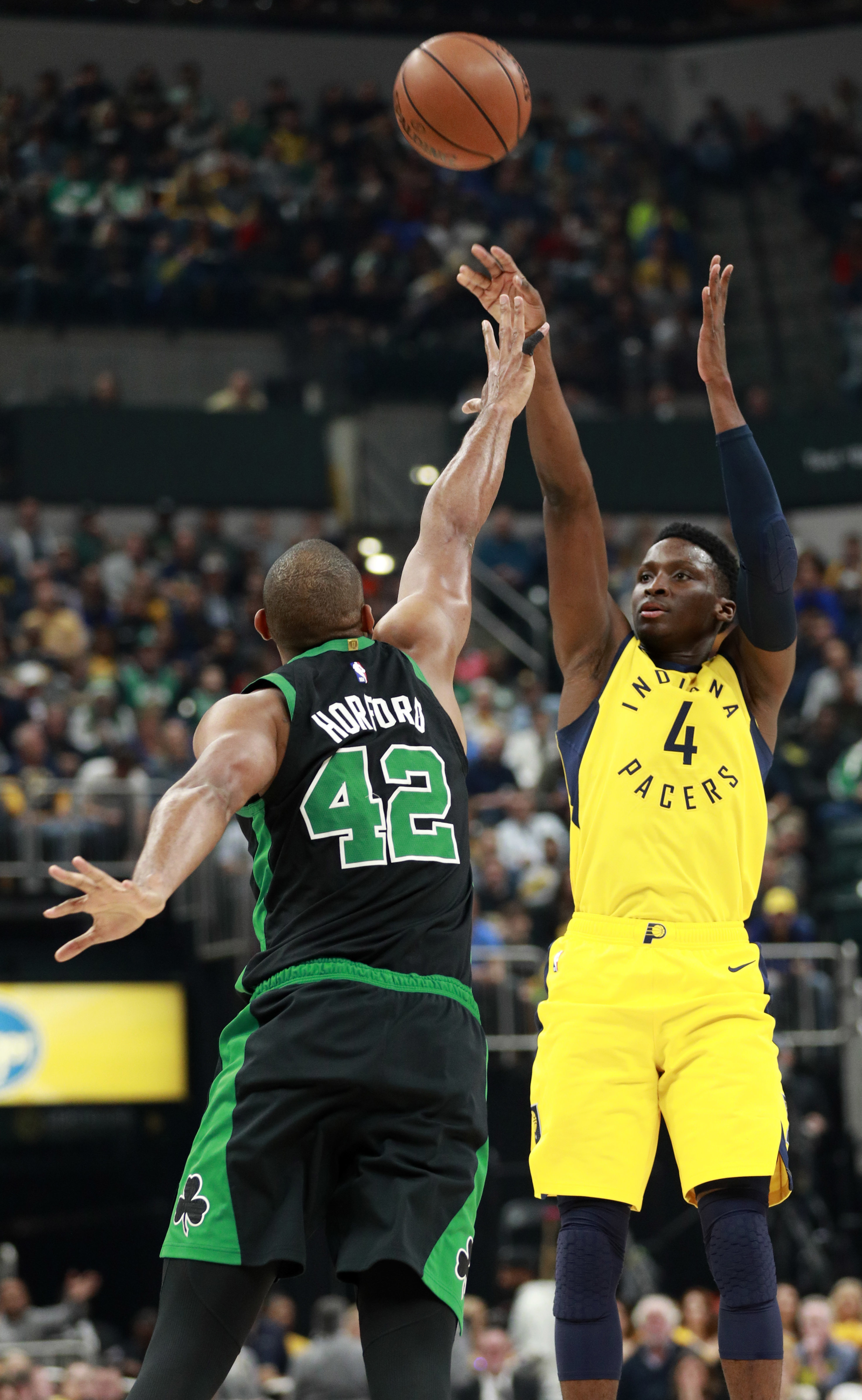 Pacers guard Victor Oladipo shoots a jump shot over Celtics center Al Horford.