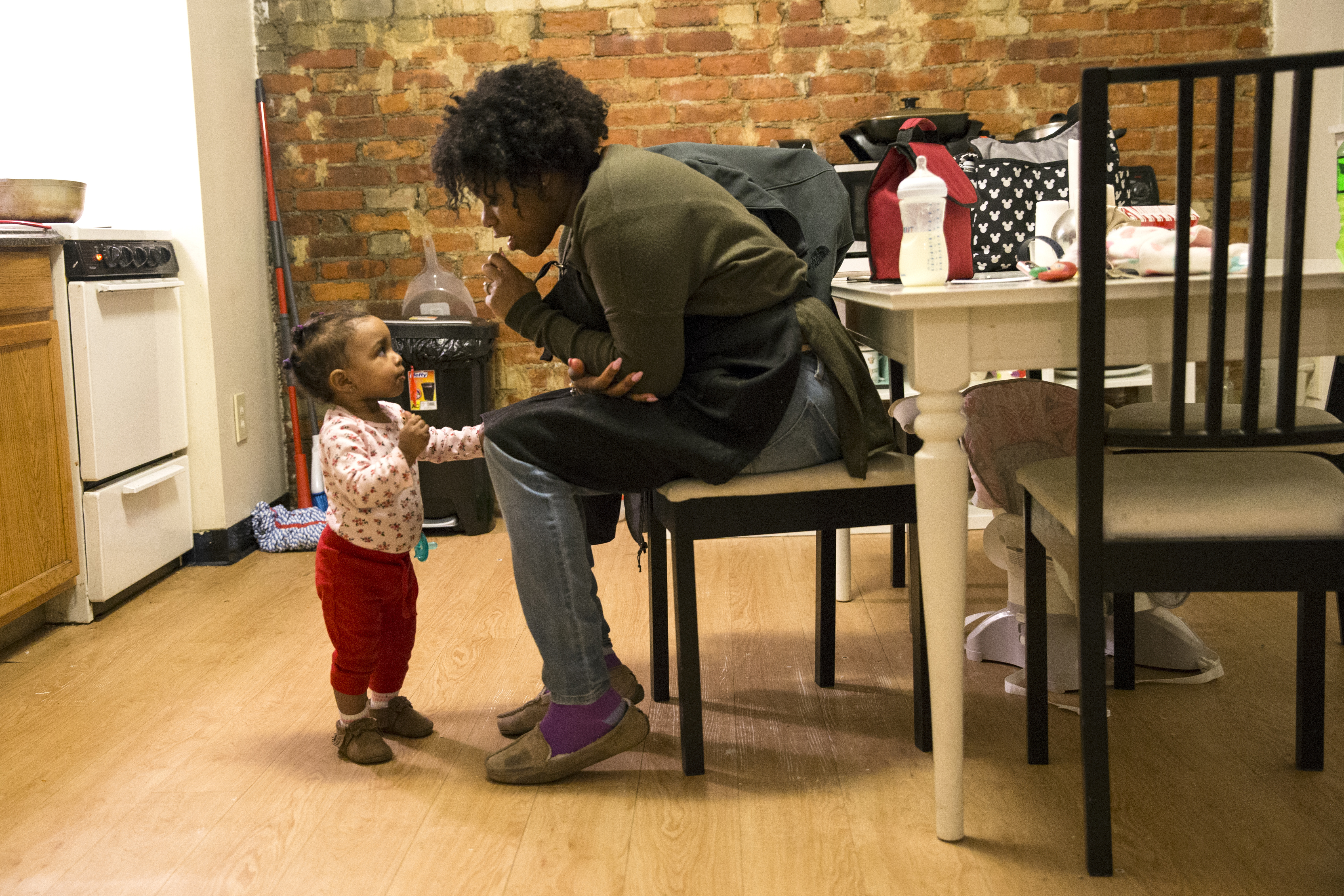Shynnah Monge-Cueto played with her 1-year-old daughter Lyannah Cueto at their home in Boston.