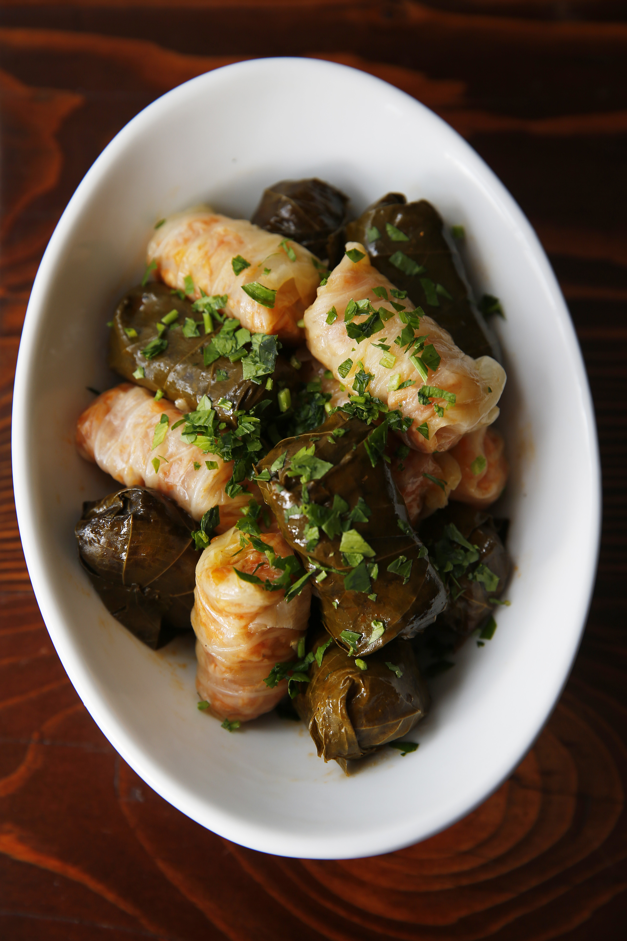 Sarmale (grape leaves and baby cabbage leaves stuffed with rice and chicken).