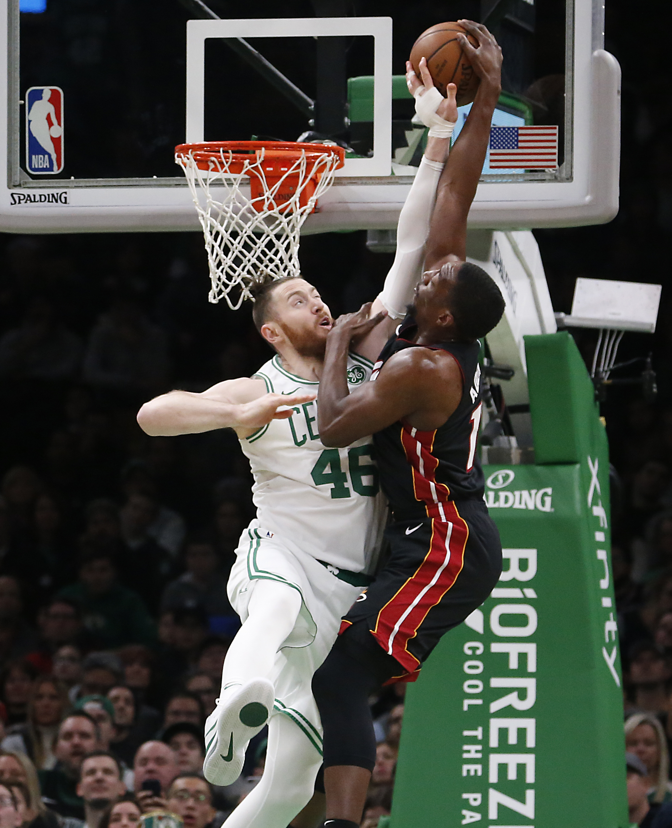 Aron Baynes blocks a dunk attempt by Miami’s Bam Adebayo in the first quarter Monday at TD Garden.