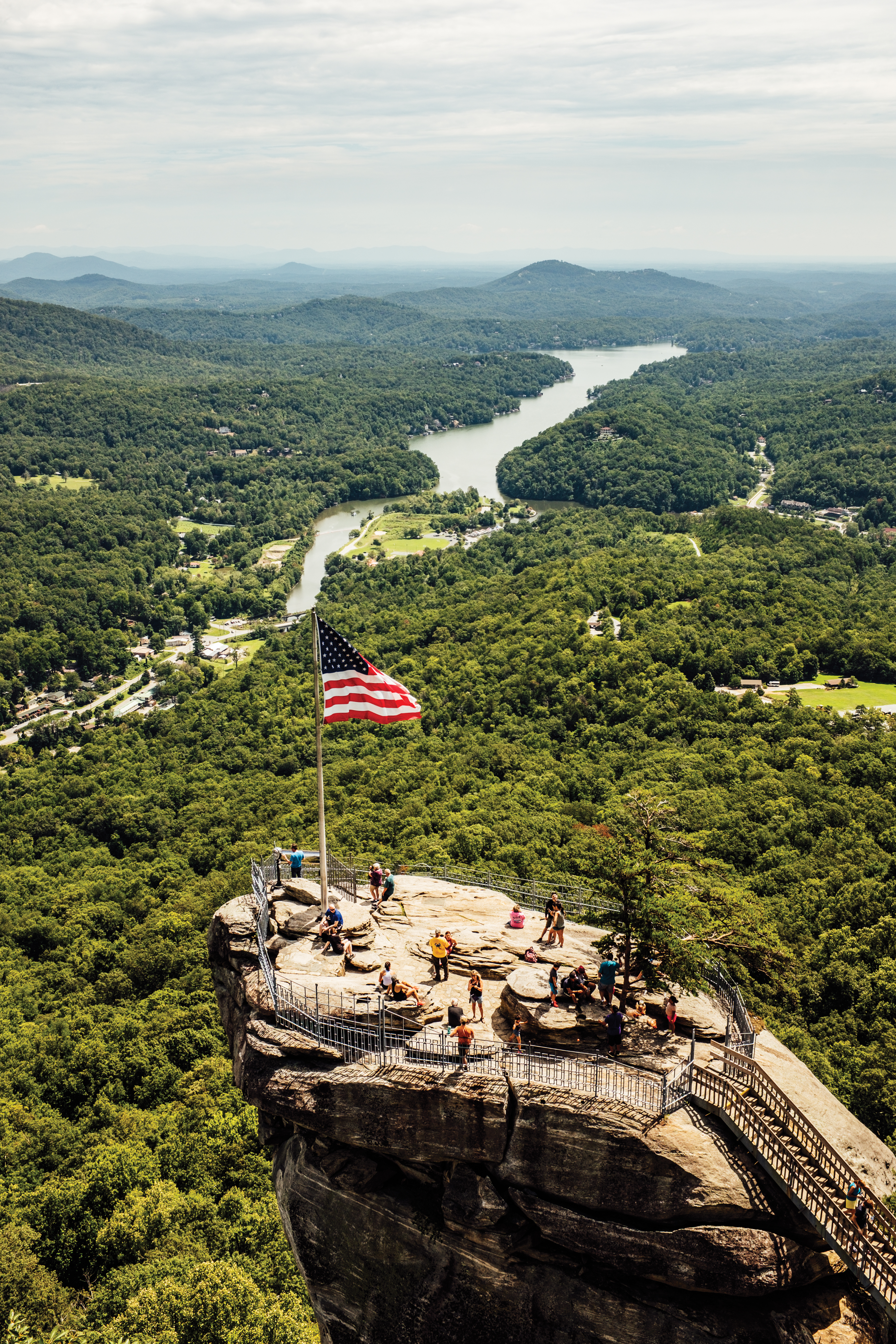 Visitors atop Chimney Rock in Chimney Rock State Park.
