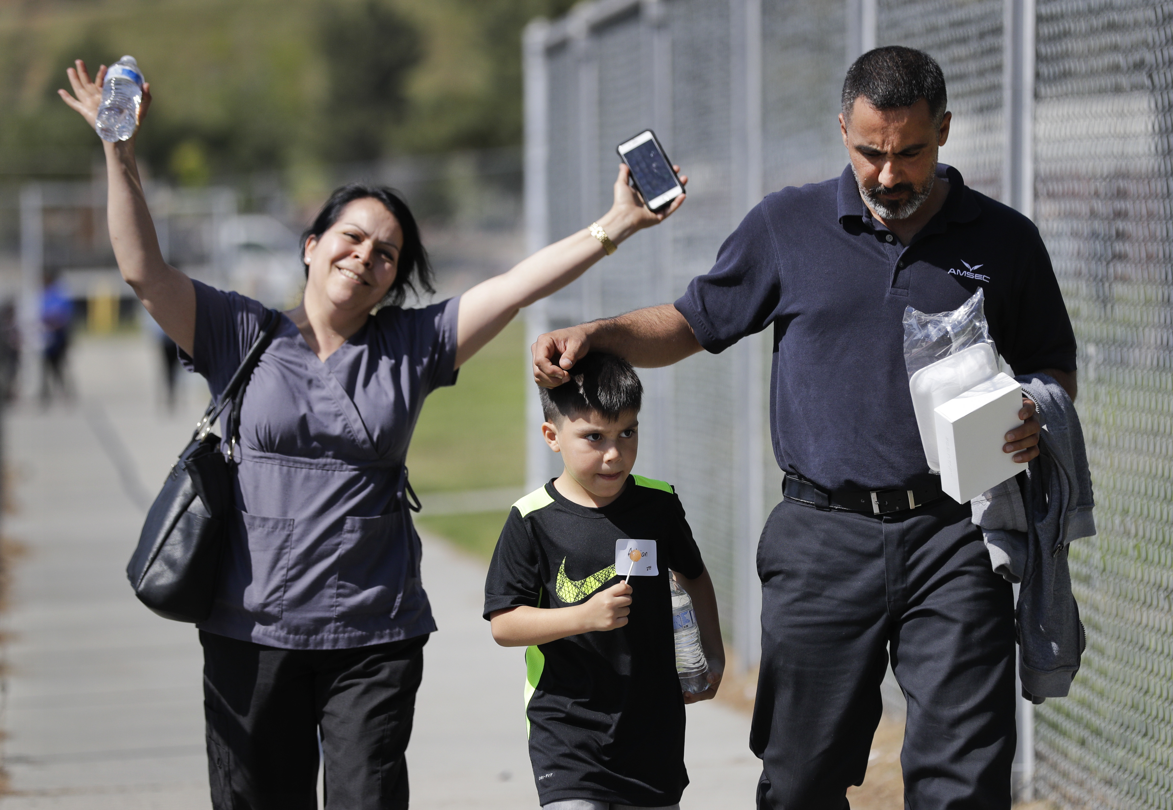 Adrian Velasco, a 7-year-old student at North Park Elementary School, walked with his parents after they were reunited Monday.