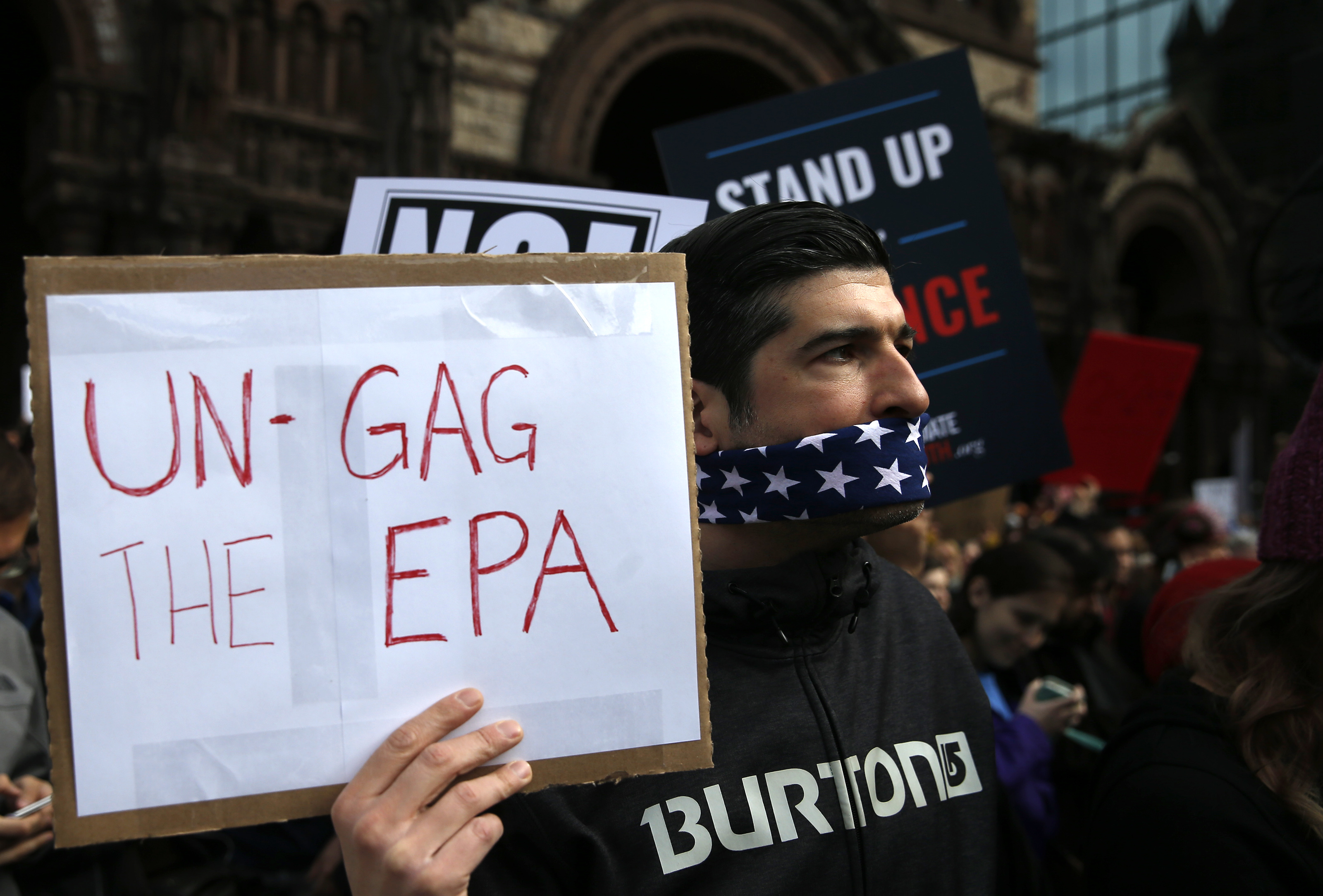 Matthew Muresan, an electrical engineer from Somerville, wore a gag at the rally.