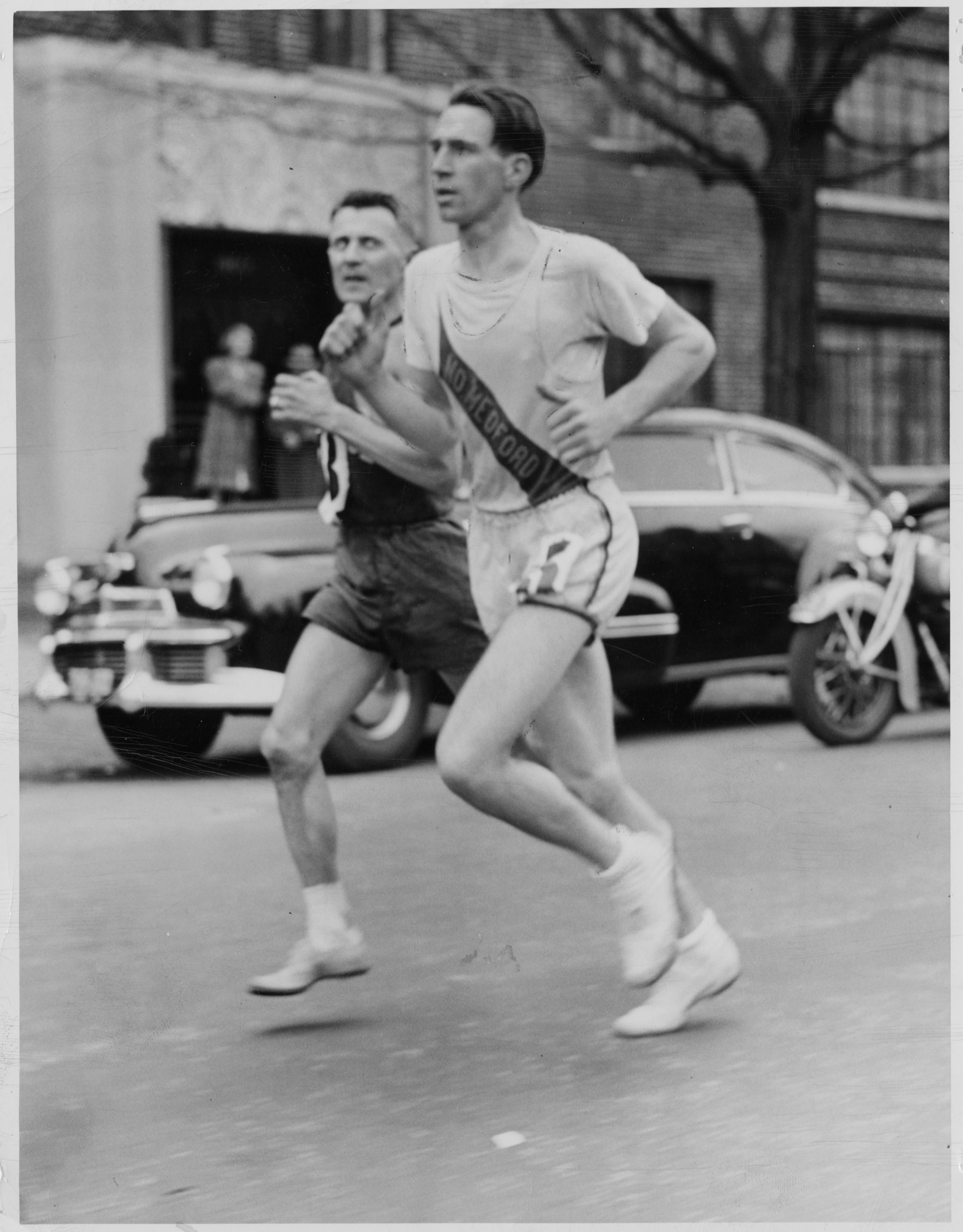 Joe Smith (right) passes Lou Gregory to take lead in the 1942 Marathon just before Cleveland Circle.