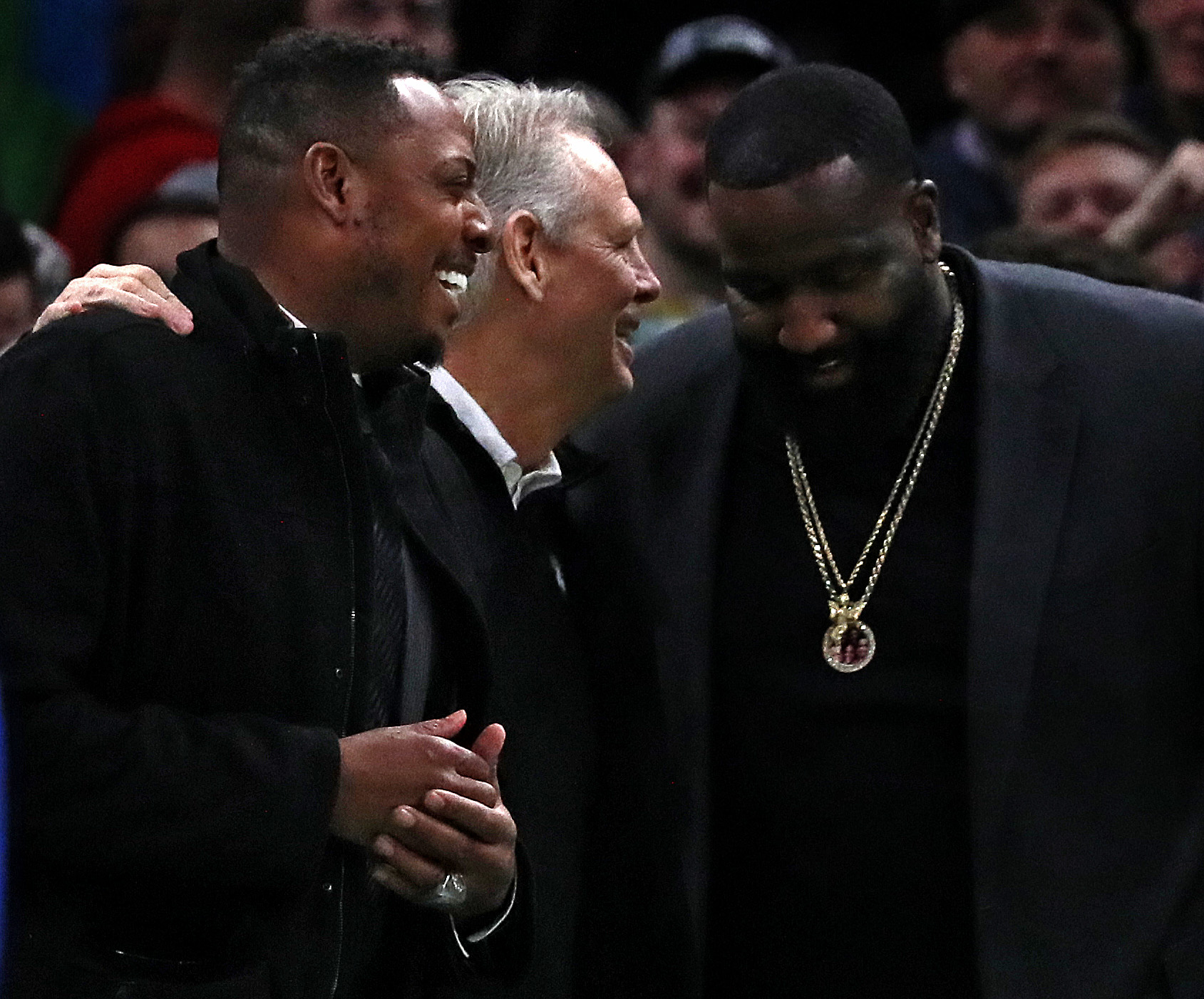 Celtics president Danny Ainge got together with former players Paul Pierce (left) and Kendrick Perkins during a timeout.