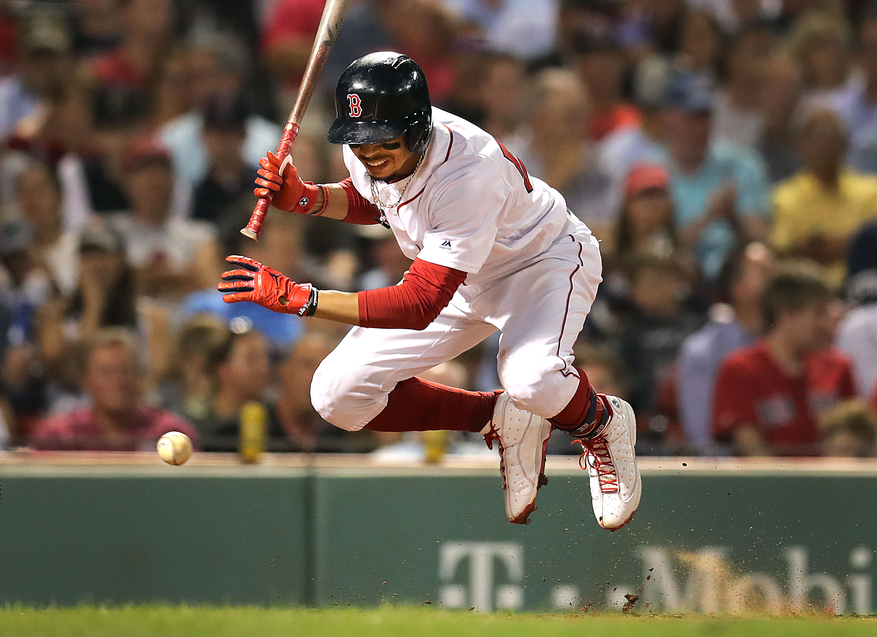 Mookie Betts jumps out of the way of a close pitch in the fourth inning.