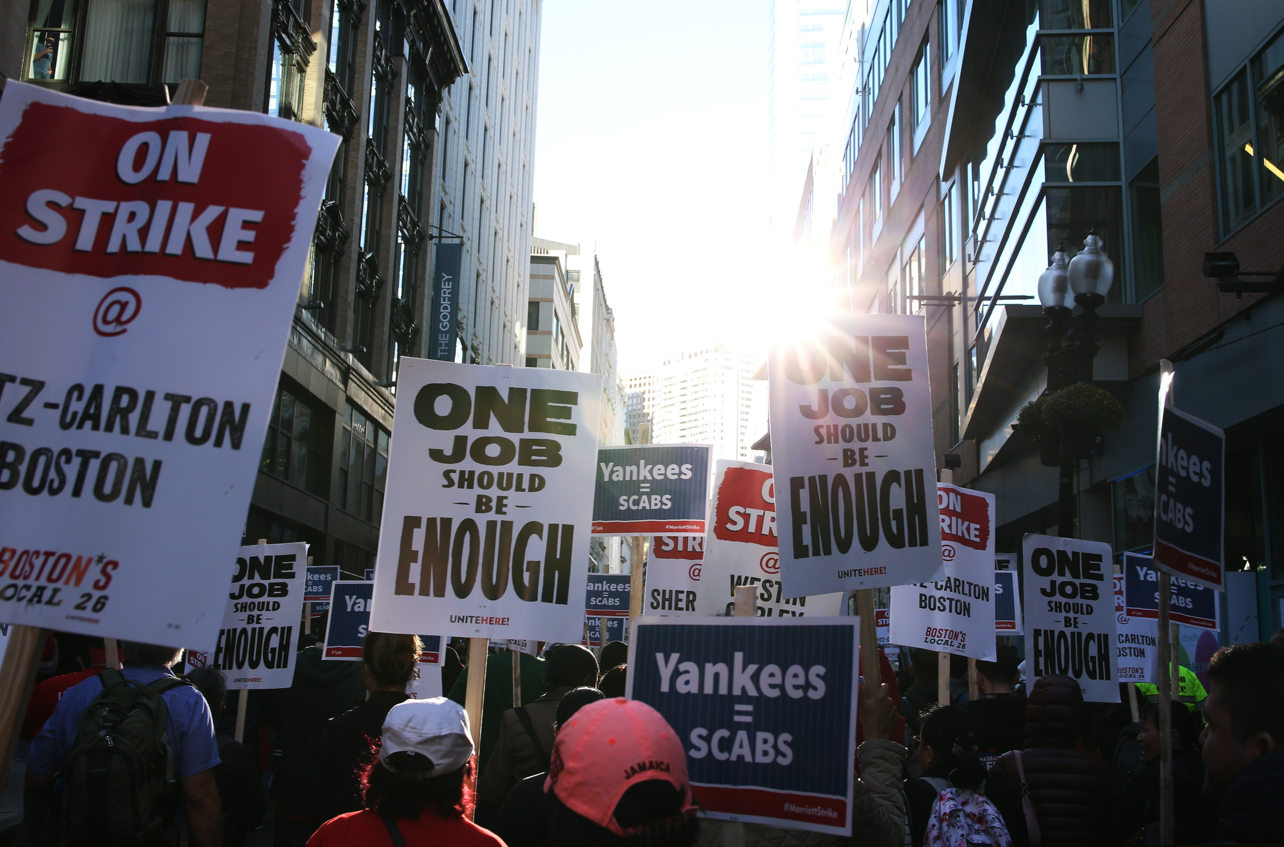 Striking hotel workers marched toward the Boston Common on Friday.