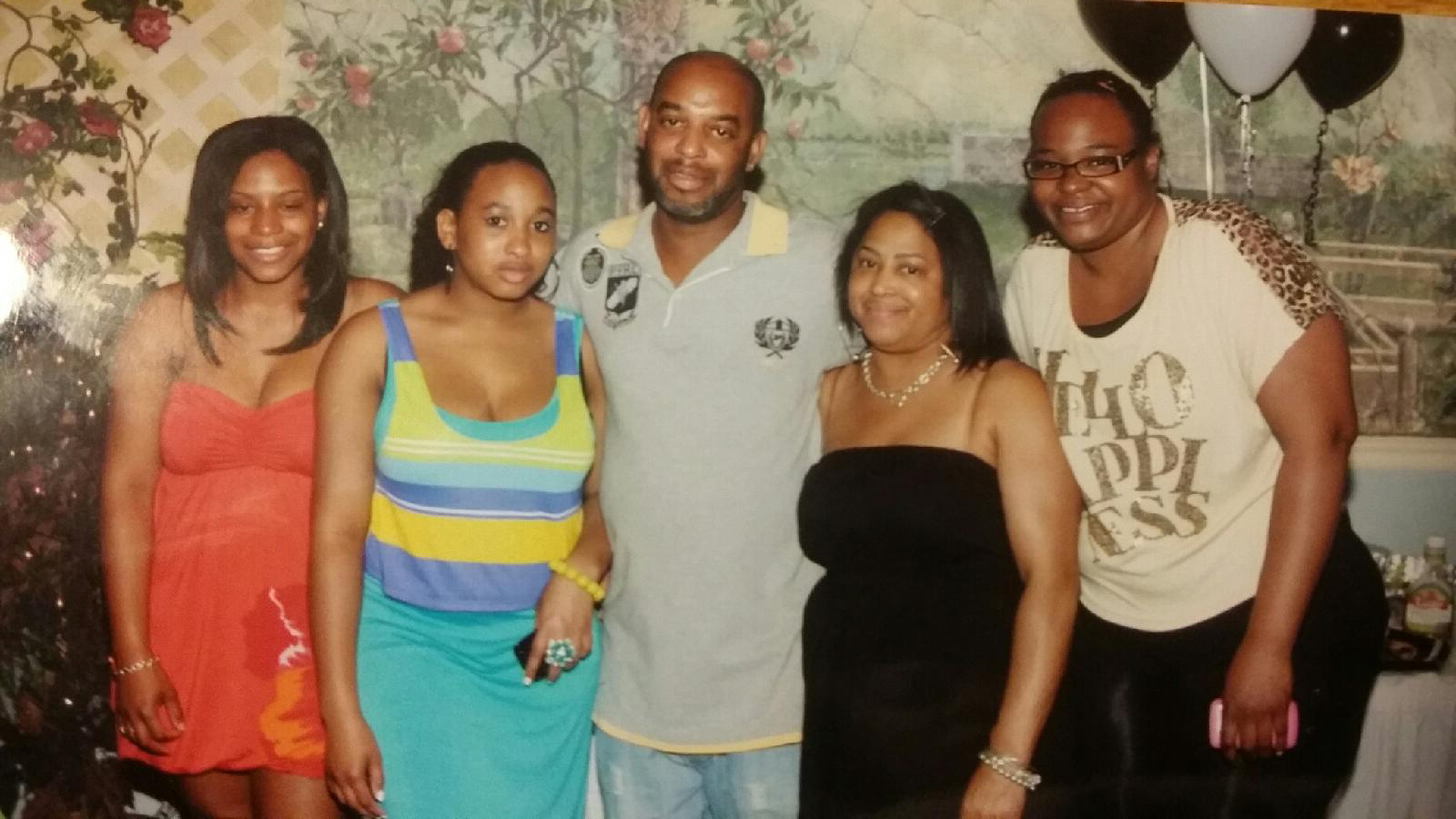 Kelvin Mattocks (center) and his wife and daughters.