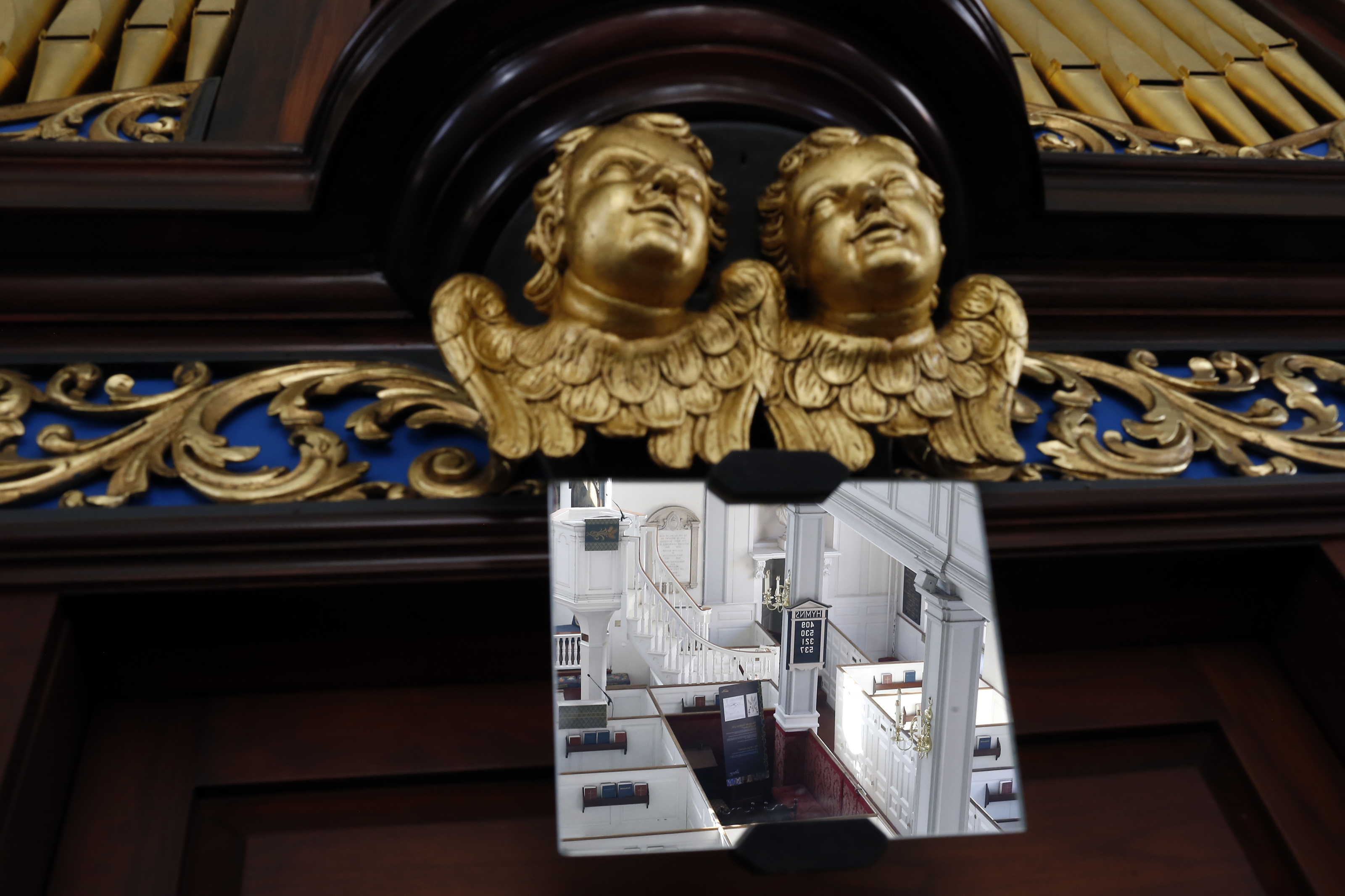 Cherubs look up from the organ console in Old North Church.