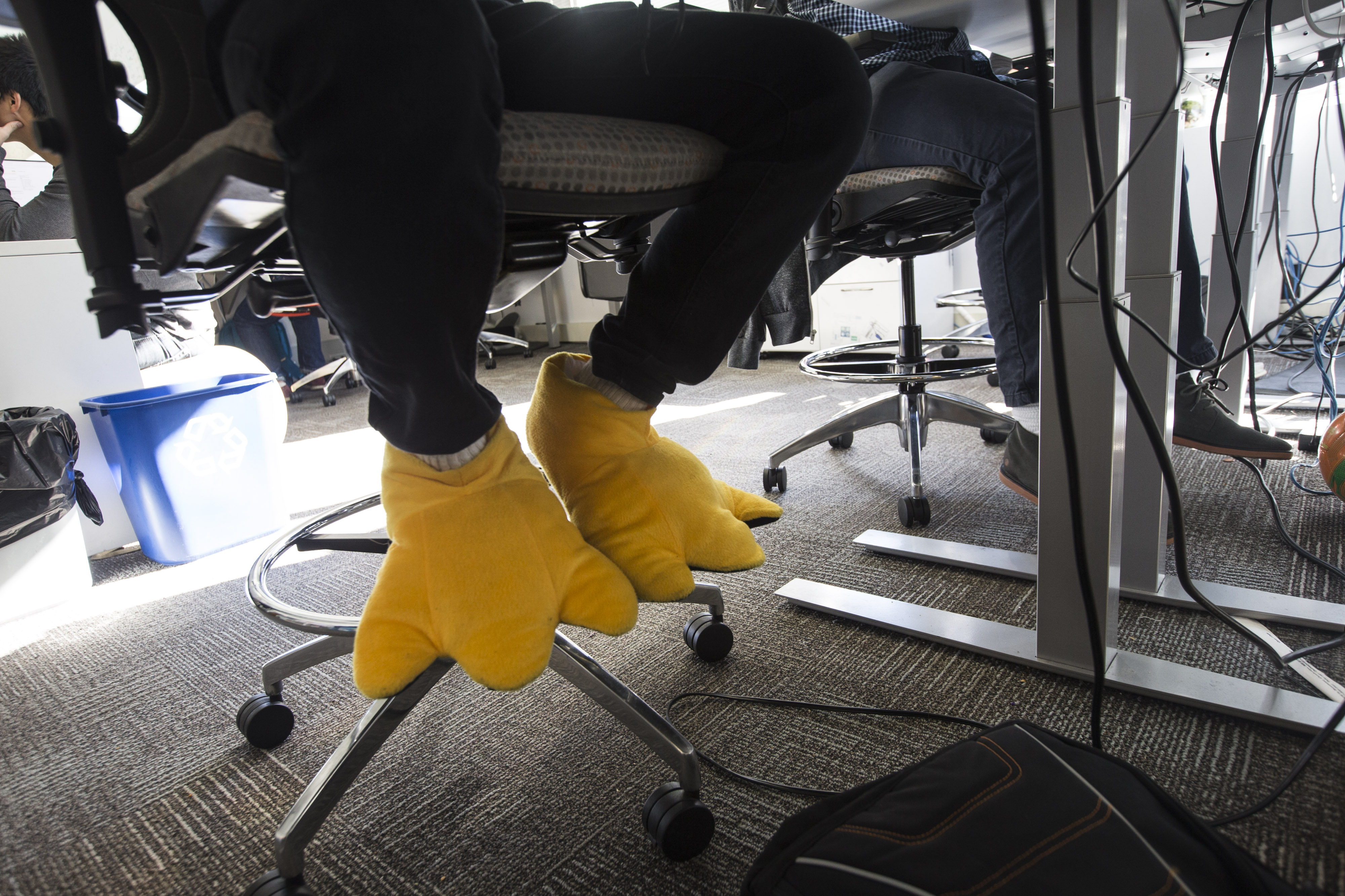 Some EverQuote employees wear slippers the company provided after a snowstorm last year so staffers would have warm, dry feet after their commute.