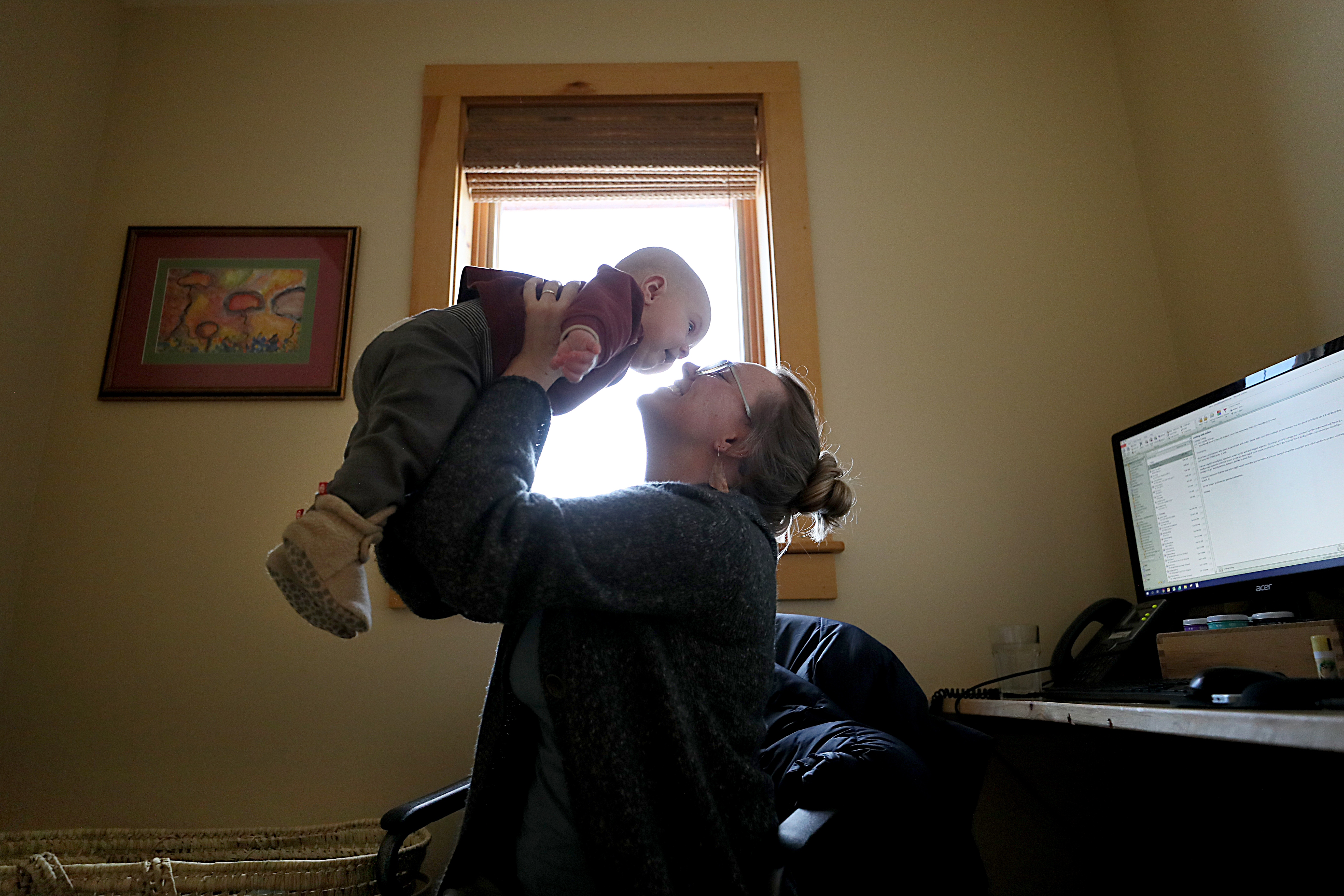 Mary Killgren attended to her 6-month-old, Shamus, at work at W.S. Badger Co.