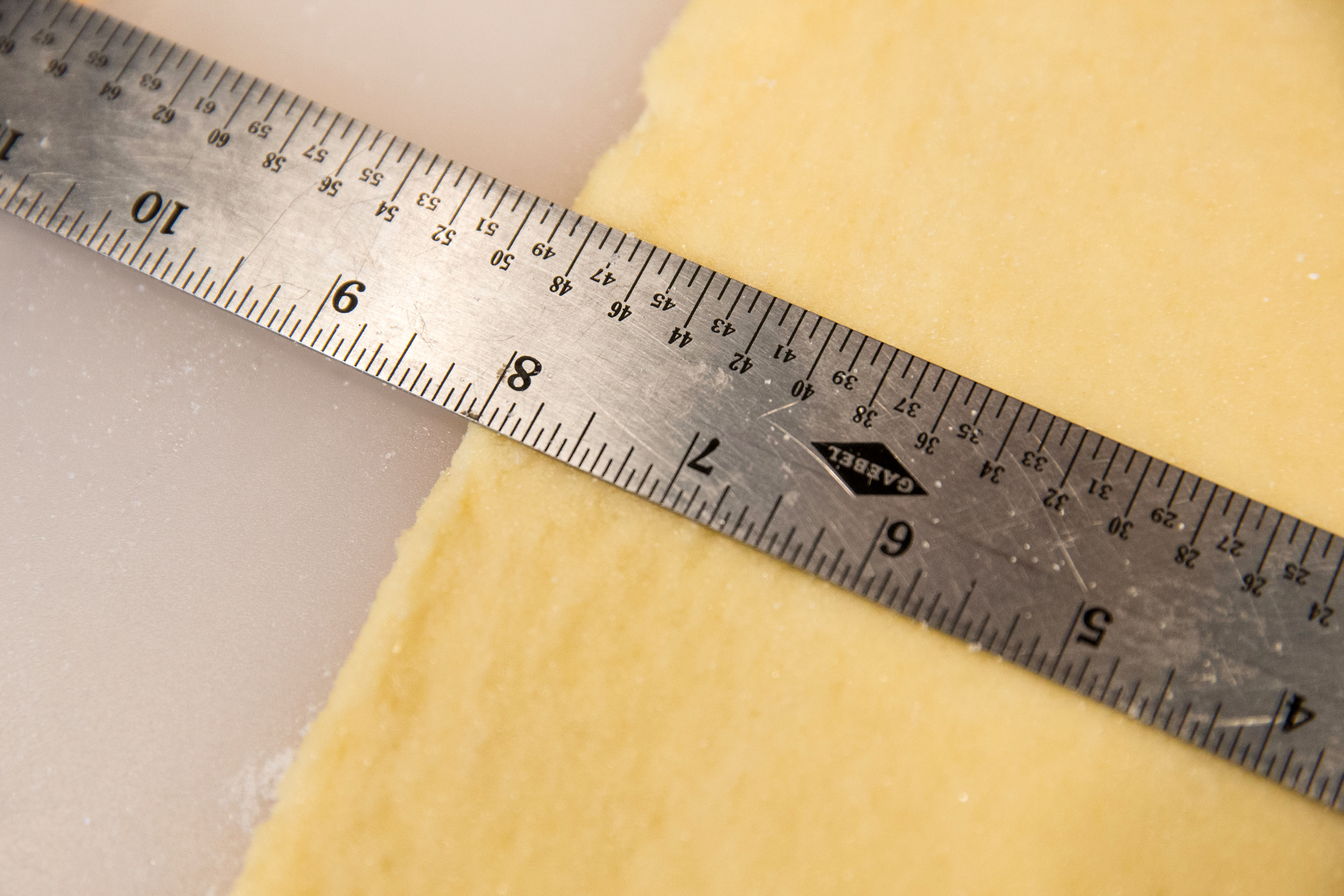 Measuring the dough.