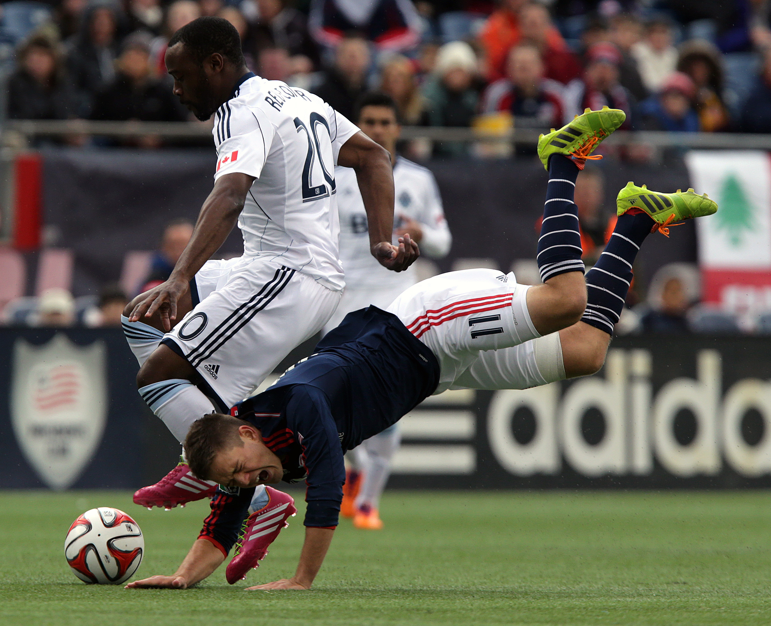 New England Revolution midfielder Kelyn Rowe was tripped up by Whitecaps midfielder/defender Nigel Reo-Coker. Reo-Coker was called for the foul.