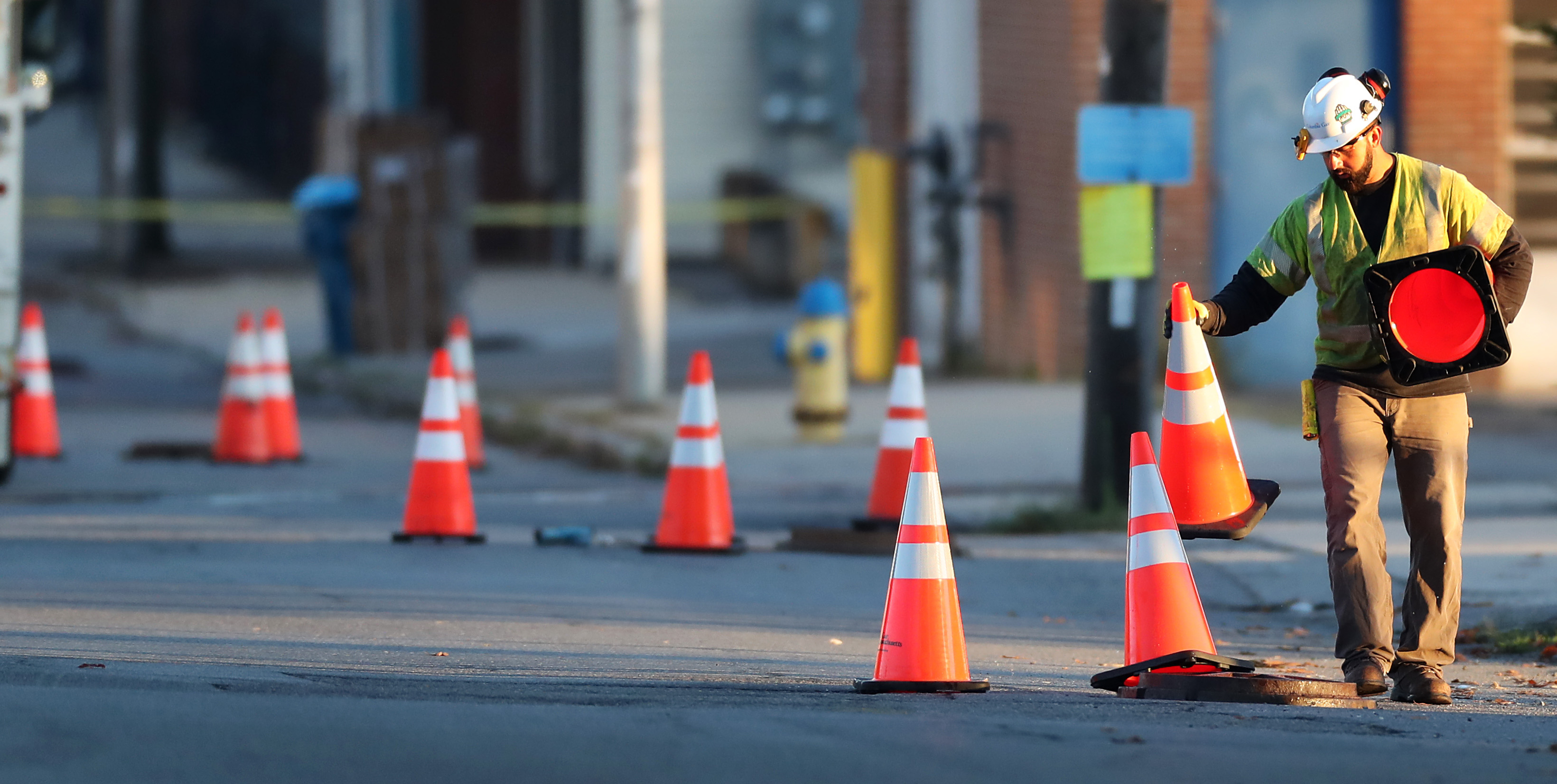 A worker placed cones along South Broadway in Lawrence.