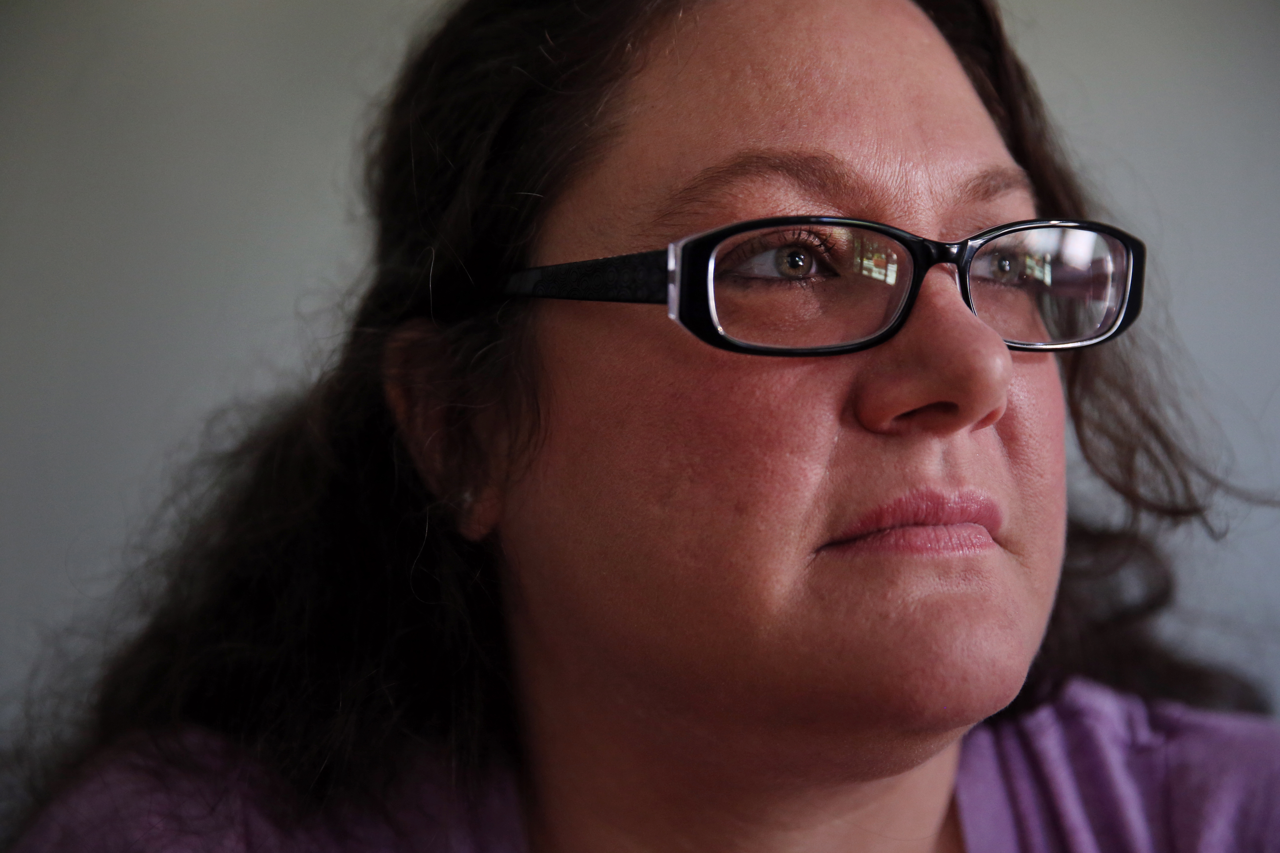 Tanya Lussier posed for a portrait at her home in Lowell.
