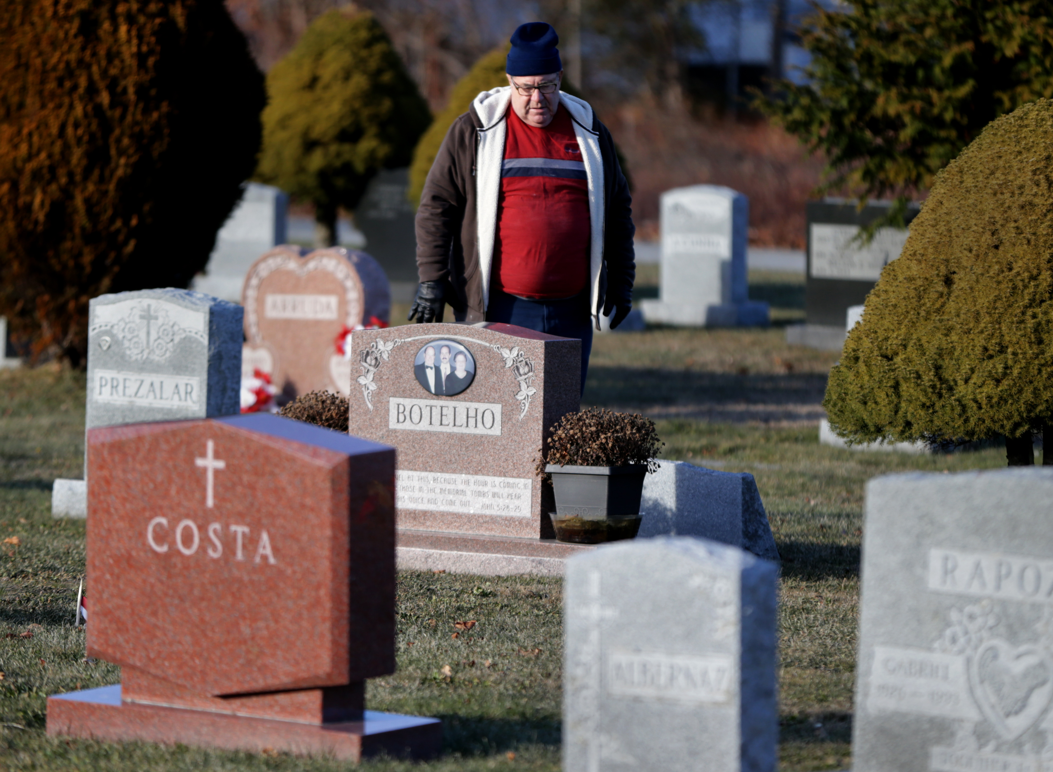 After the Botelho family business closed, one of the four brothers who ran it, Victor M. Botelho, killed himself. John Botelho visited his brother’s gravestone.