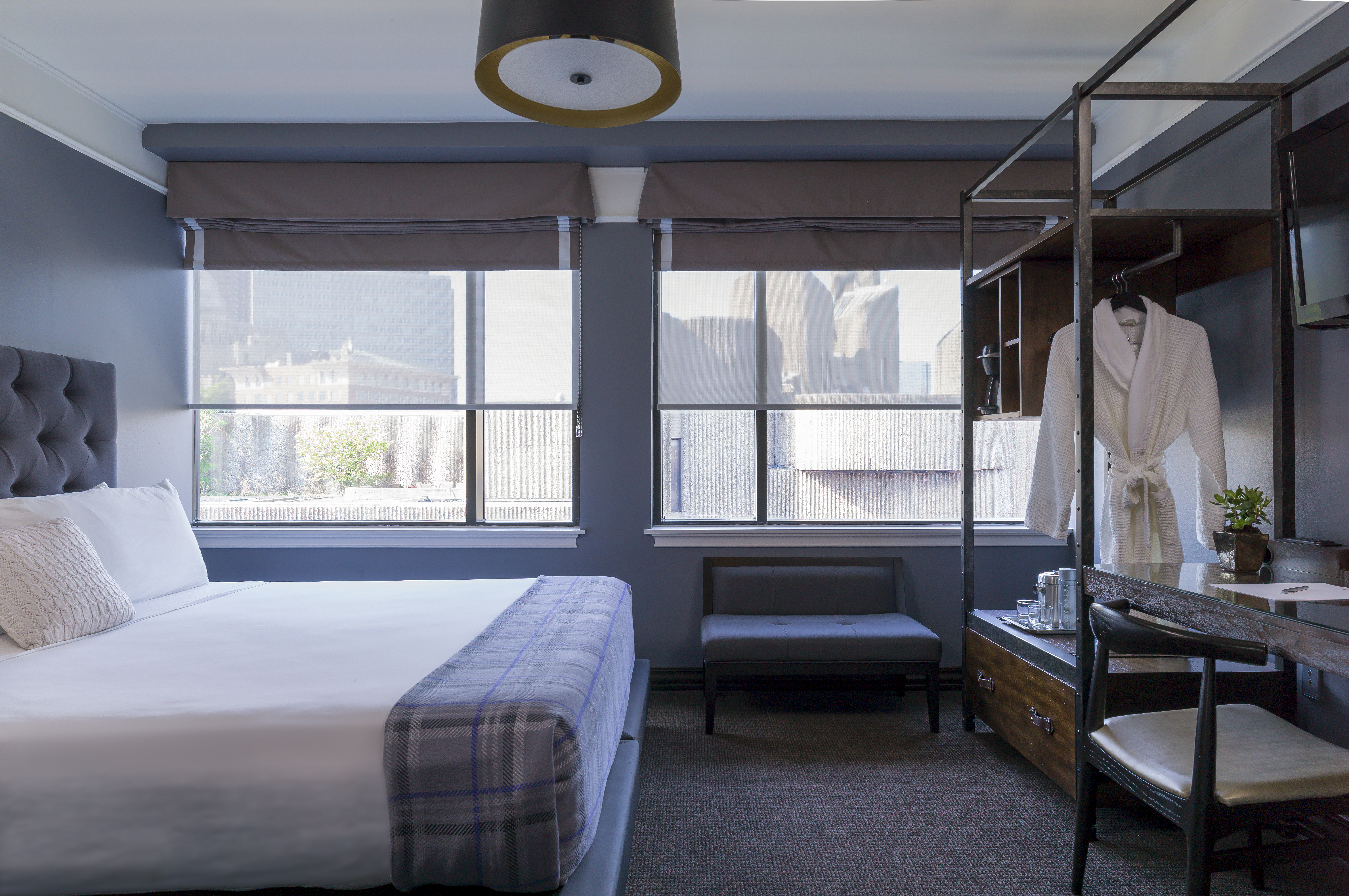 A sleek guest room at the Boxer Boston.