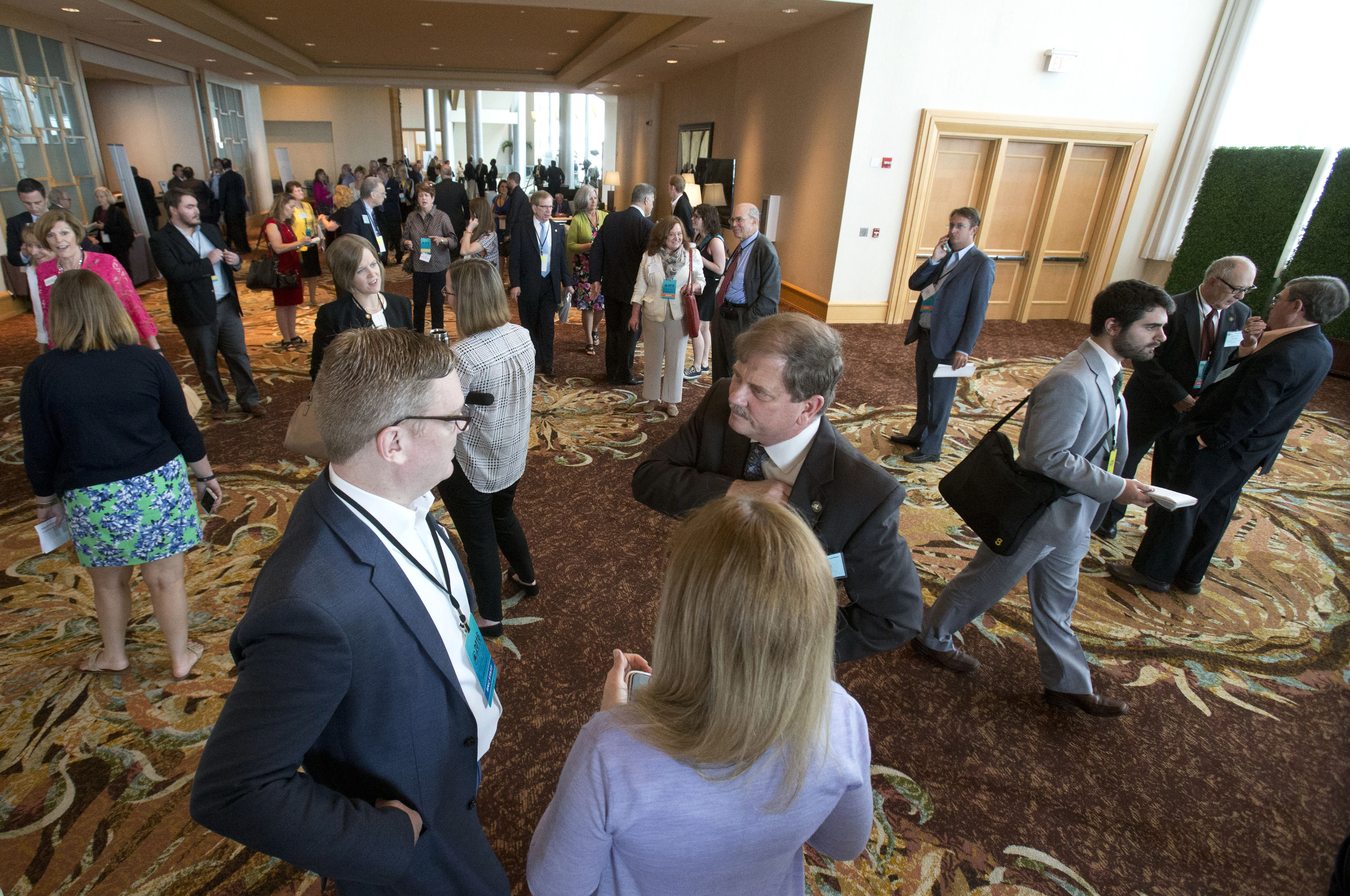 Members and guests milled about before the start of the general session Friday.