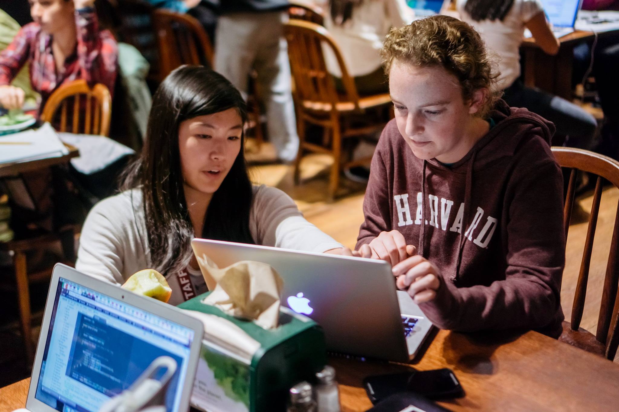 A CS50 staff member helped a student during office hours at Harvard University.