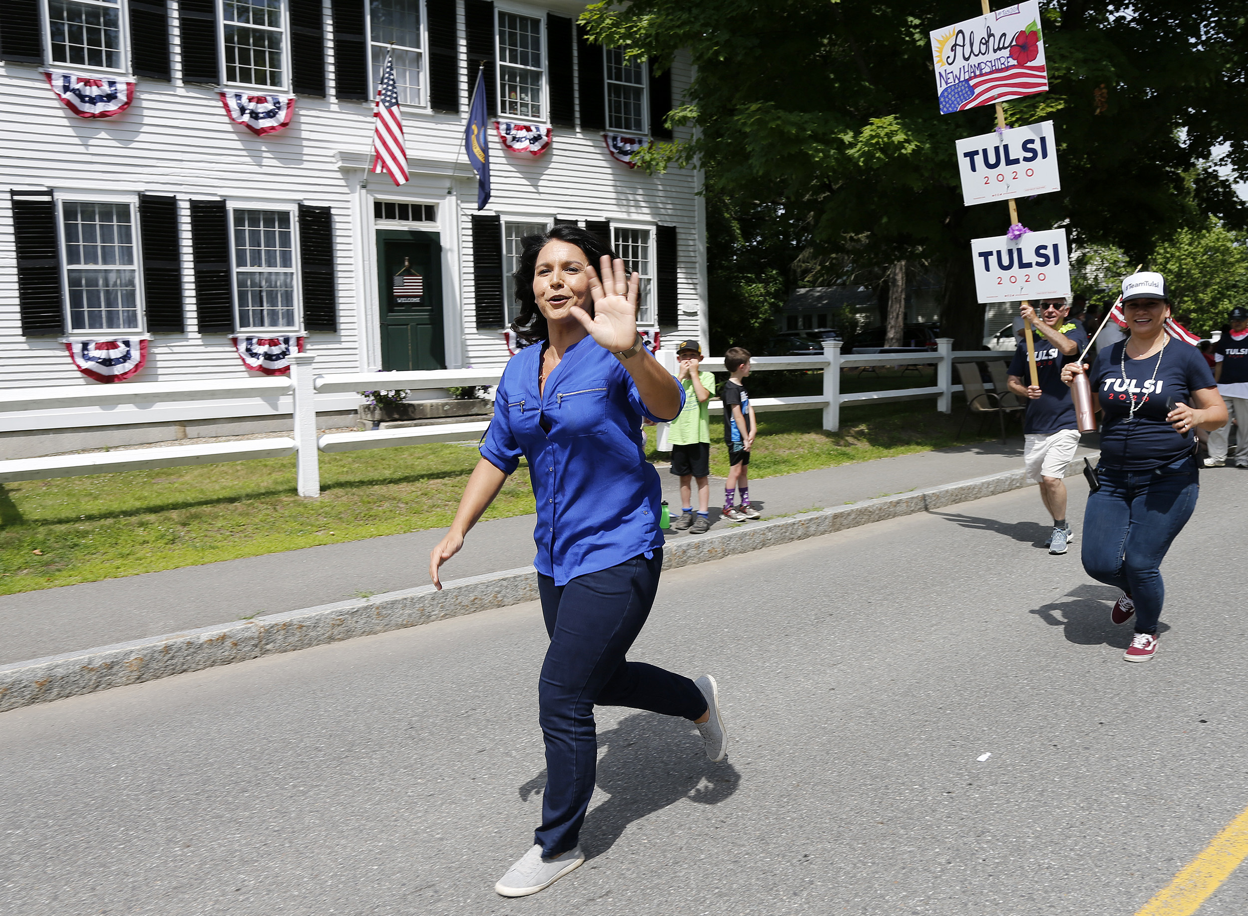 Representative Tulsi Gabbard waved along the parade route.