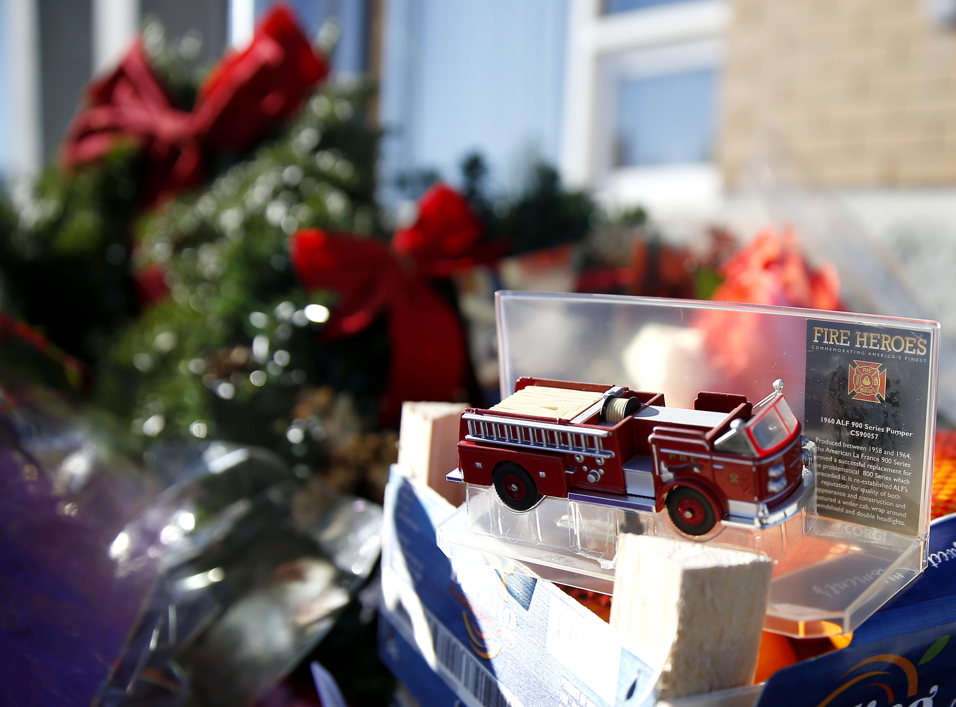Worcester, MA, 12/10/2018 -- A toy firetruck was placed at a makeshift memorial in tribute to fallen firefighter Christopher J. Roy outside of his fire station. (Jessica Rinaldi/Globe Staff) Topic: 11worcesterpic Reporter: