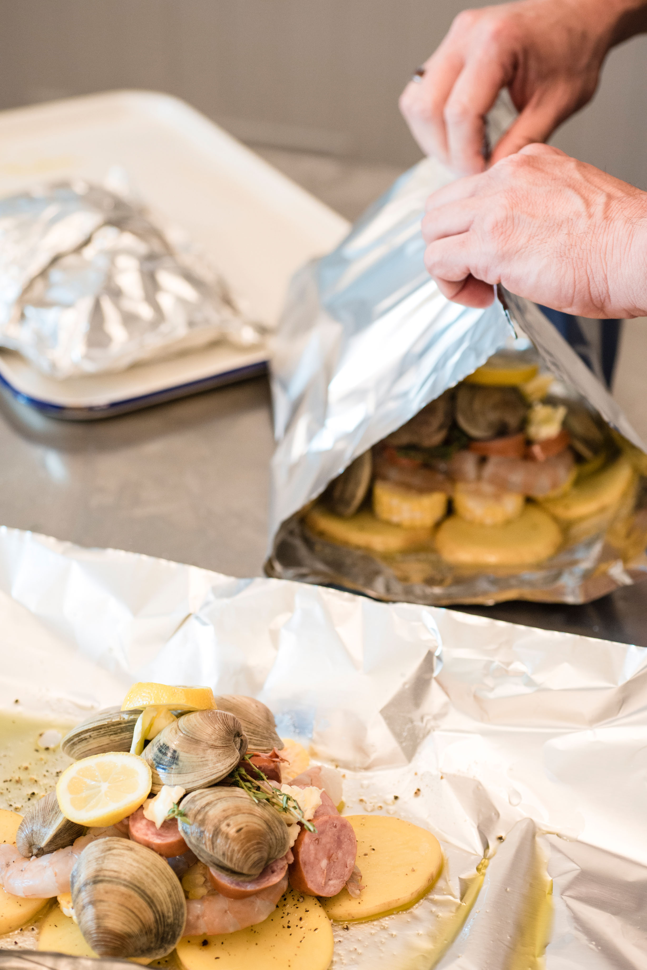 Tip: Seal the packets tightly so that steam can build inside. Start with the top and bottom edges, folding them together several times and crimping them tightly, and then fold the sides several times. (Foil wider than the standard 12 inches makes sealing the sides a little easier.) Leave a little headroom above the contents for the packets to puff.