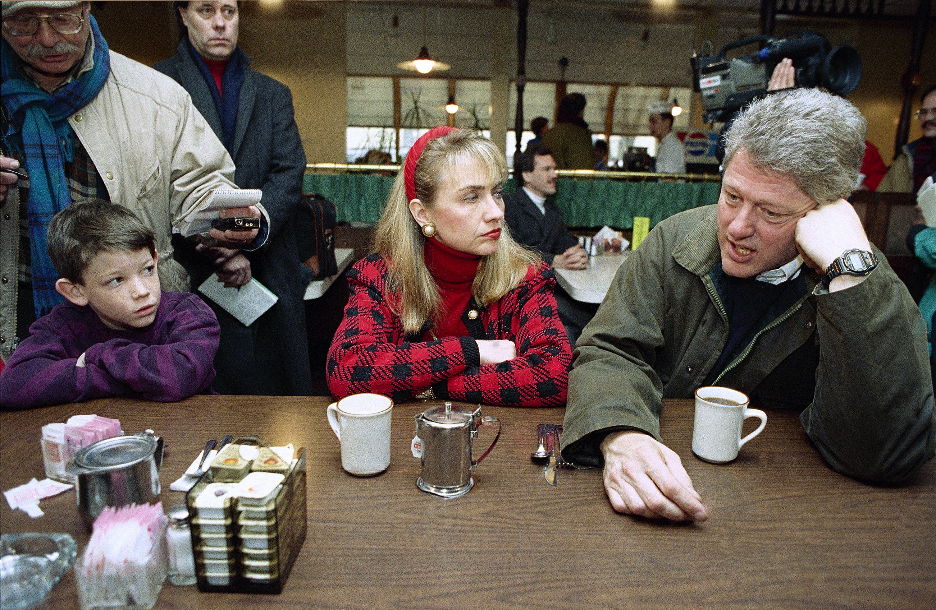 Andrew Dodwell, 9 (left), watched as Democratic presidential hopeful Gov. Bill Clinton, of Arkansas, and wife Hillary Rodham Clinton, sipped coffee at Blake’s Restaurant in Manchester, N.H., on Feb. 15, 1992.