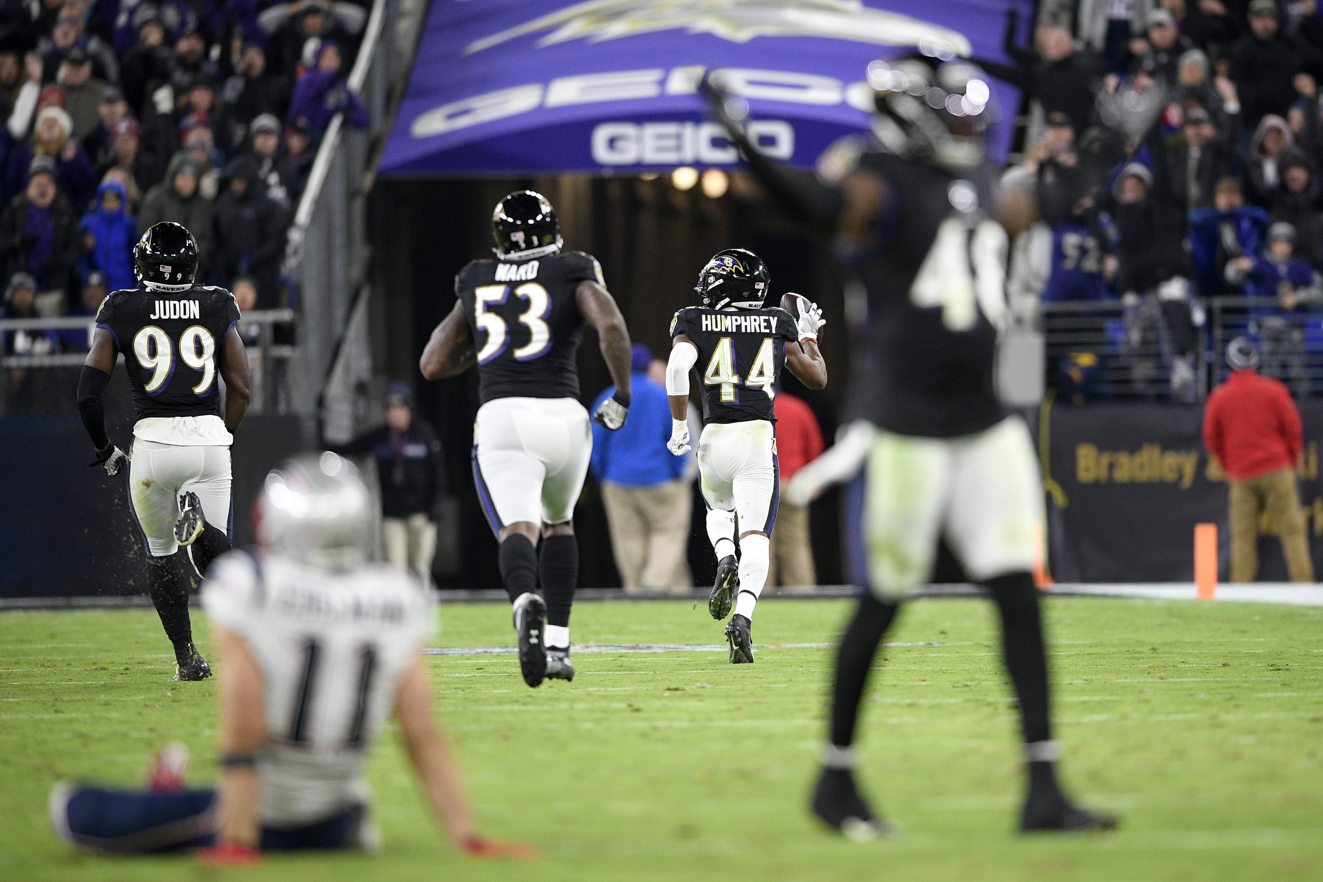 Baltimore cornerback Marlon Humphrey (44) runs for a touchdown after recovering a Julian Edelman fumble in the second half of Sunday’s game.