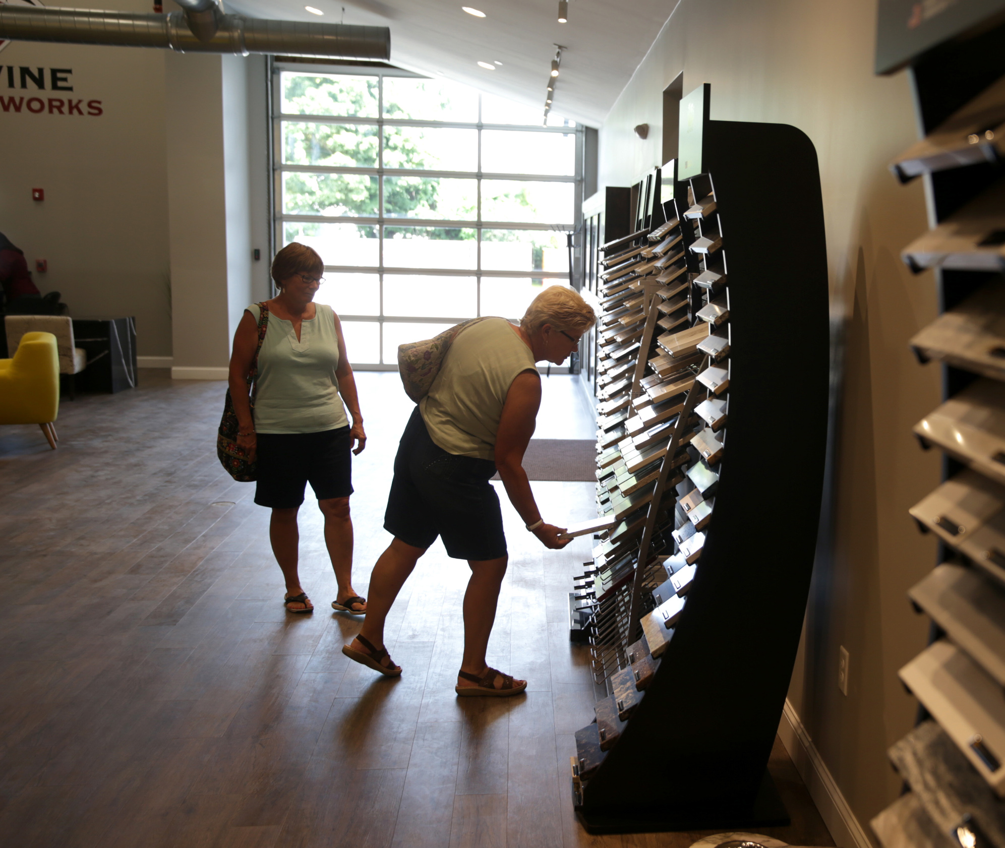 Shoppers visit Divine Stoneworks at MetroWest Design Center in Ashland.
