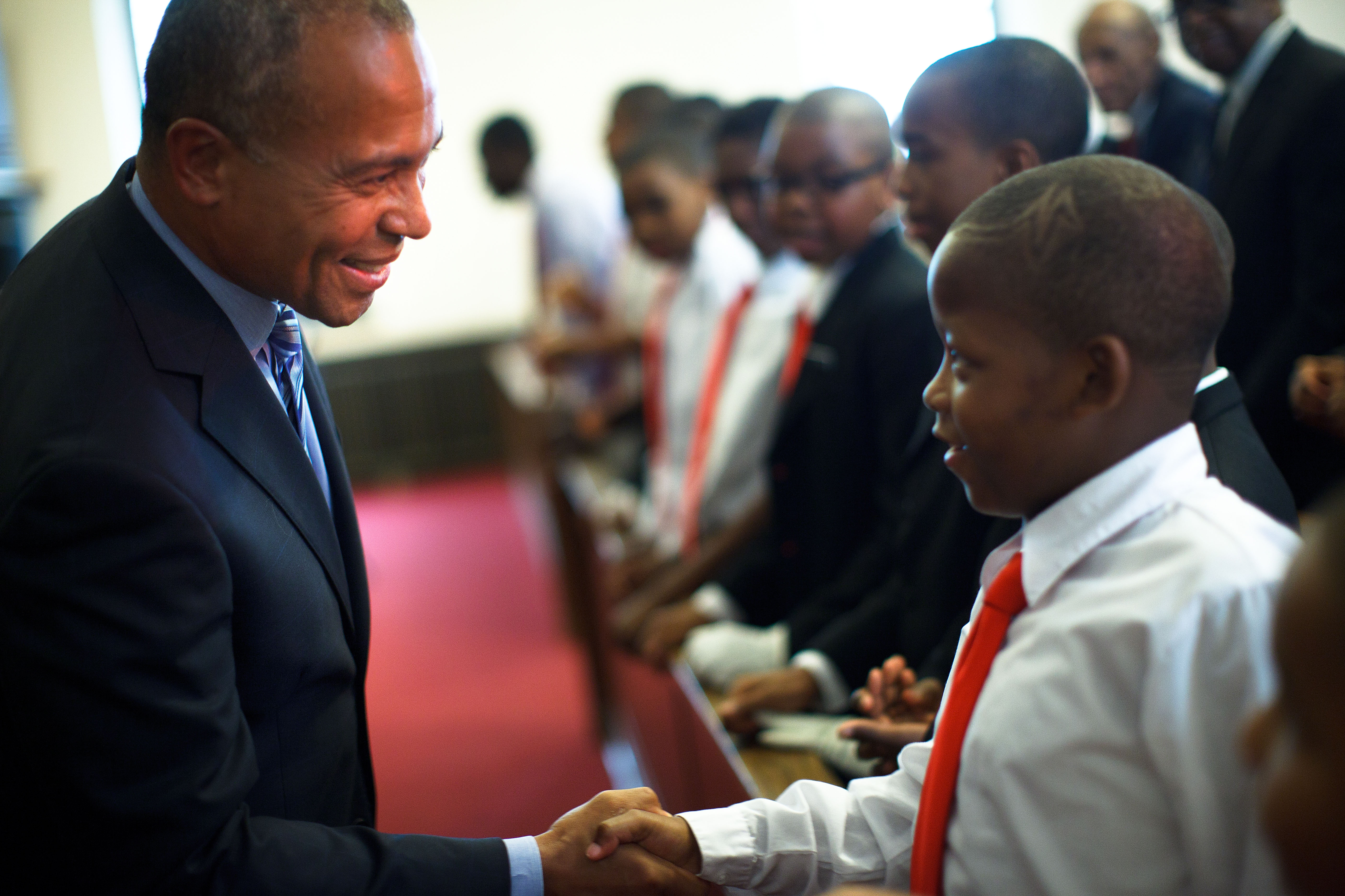 Governor Deval Patrick shook hands with 9-year-old Eugene Van Buren of Roxbury.