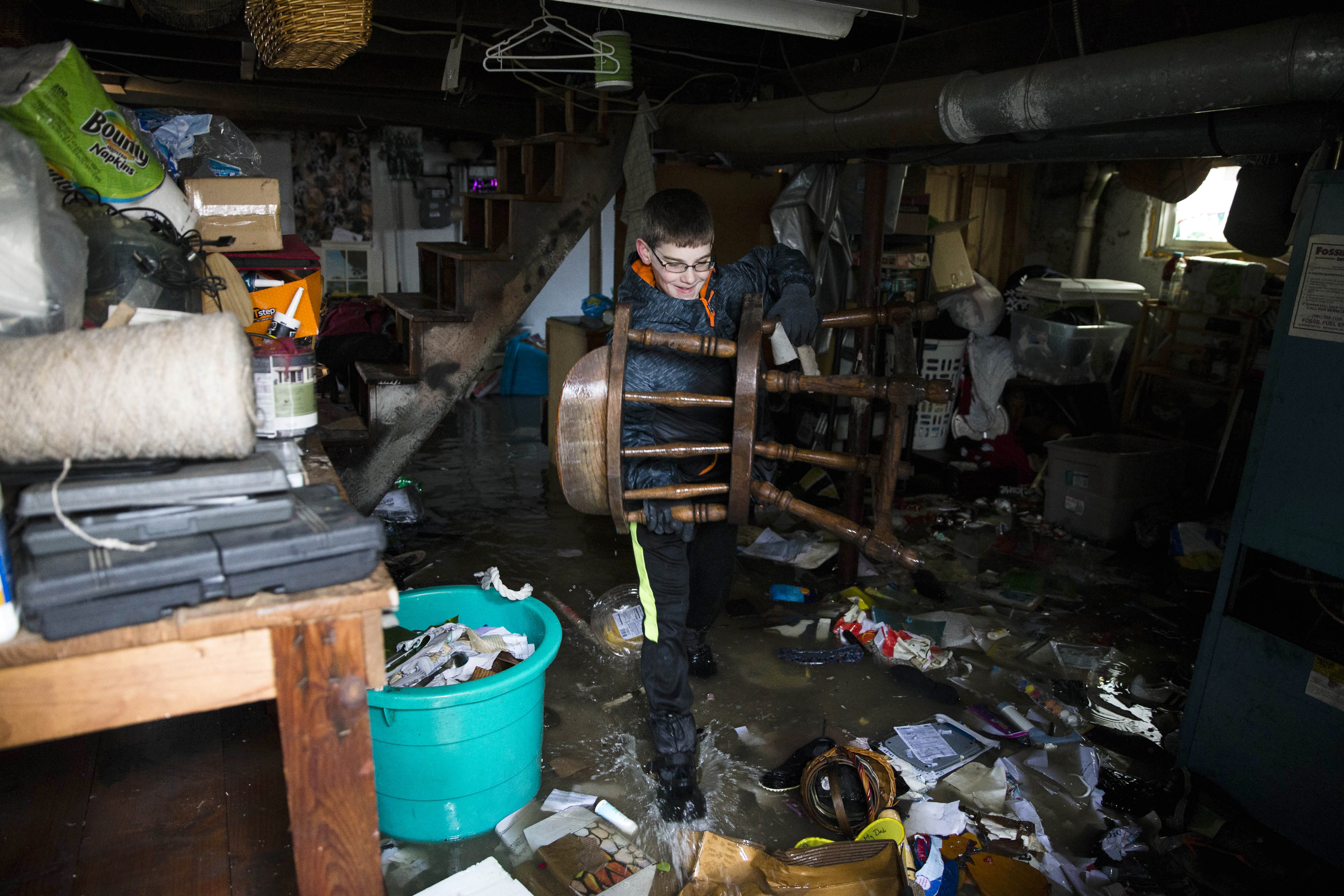 Walter Bardon carried items out of the basement of his family's home.