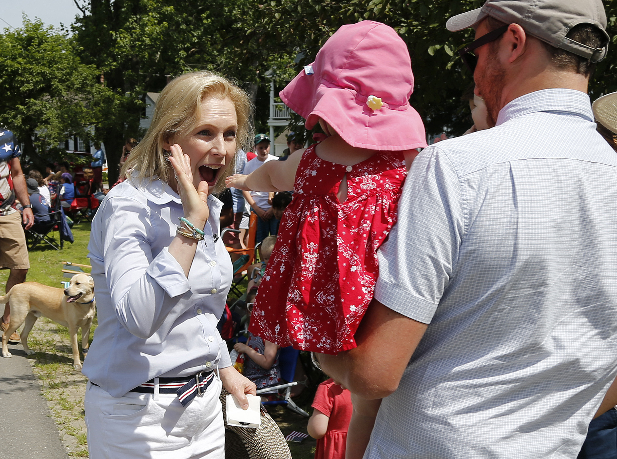 Senator Kirsten Gillibrand gave a high-five to a child along the route during the Fourth of July Parade in Amherst.