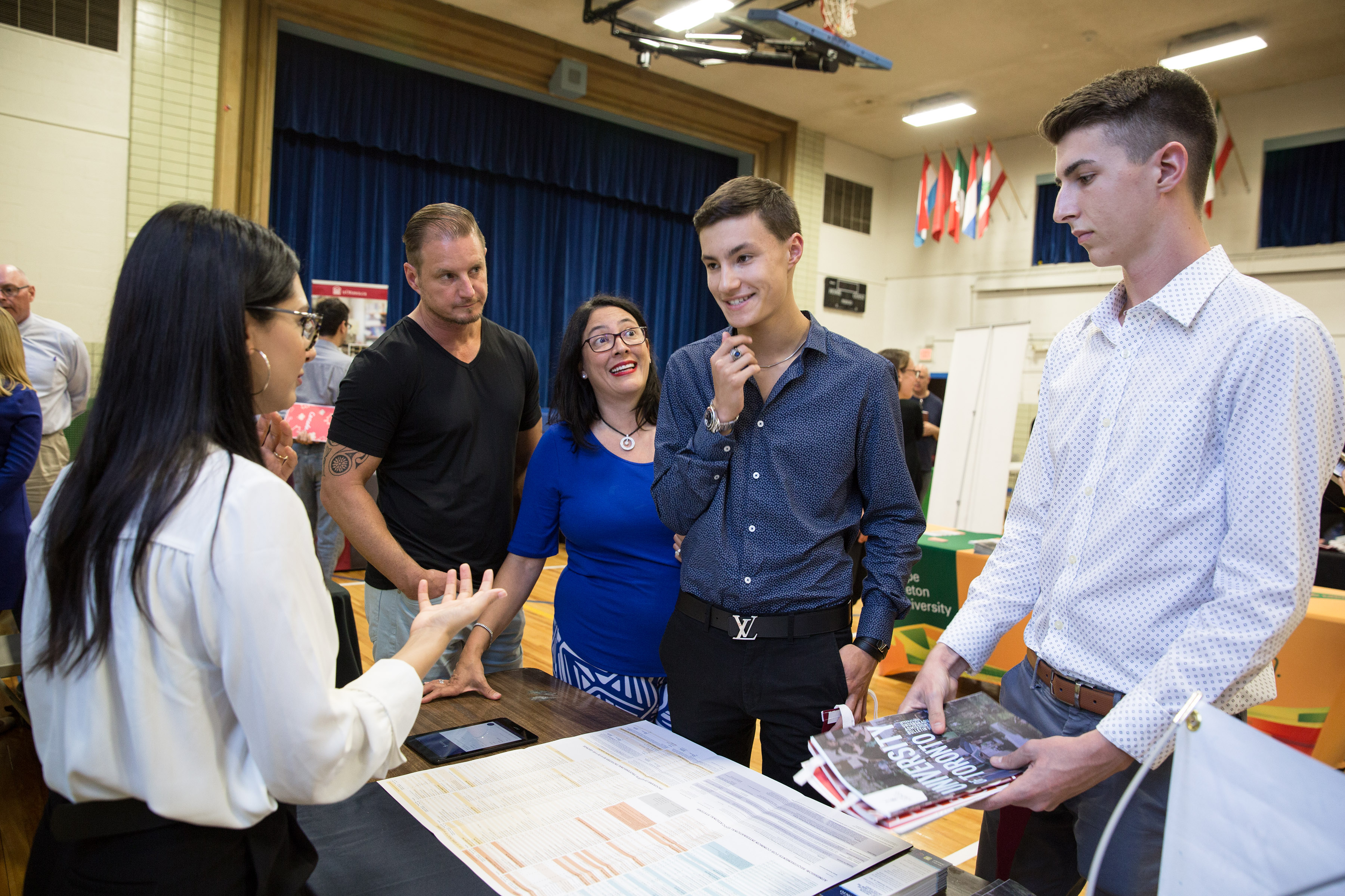 From left to right: Mariya Kala, recruiter from the University of Toronto, talked with Jon Bowers, Lina Bowers, Jonathan Bowers, 17, and Zeth Oakes, 17, about what the school has to offer during the EduCanada fair.