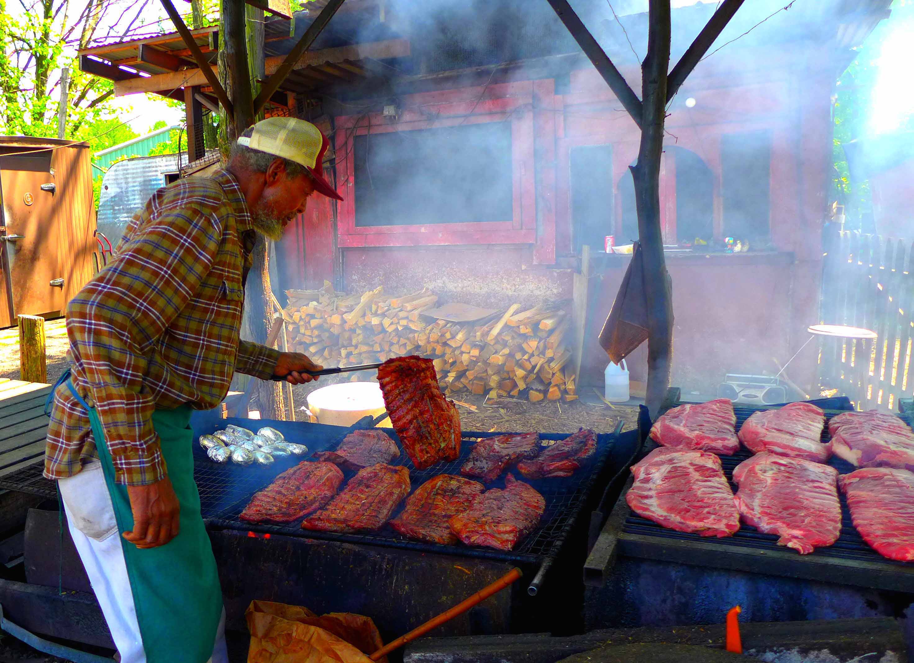 Curtis Tuff of Curtis’ BBQ in Putney, Vermont, tends to ribs.