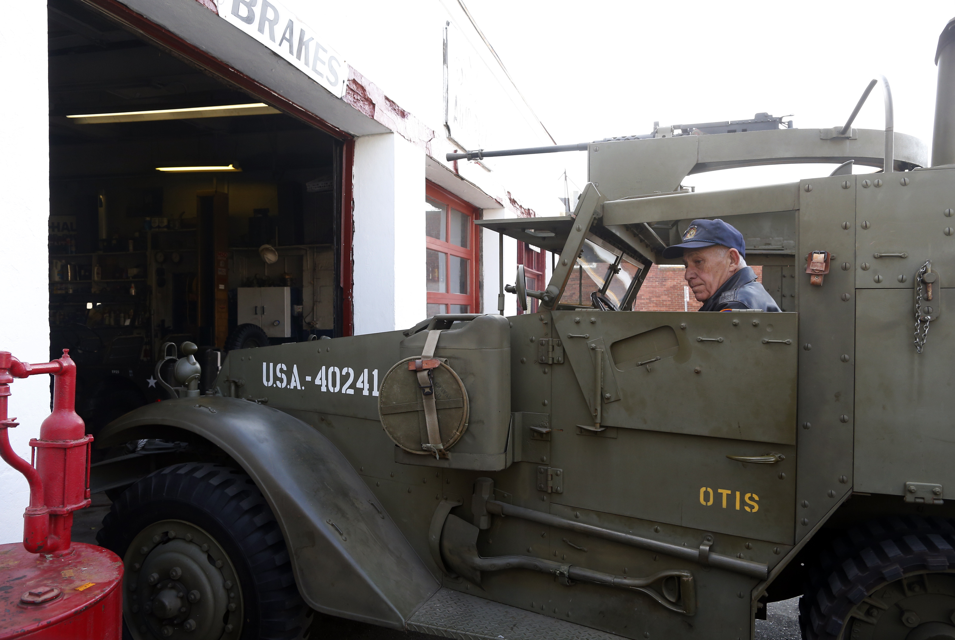 Richie Duval backed a 1943 M3 half-track out of his Winthrop repair shop. He and other vets, known as the Magee’s Corner Militia, have restored several old army vehicles.