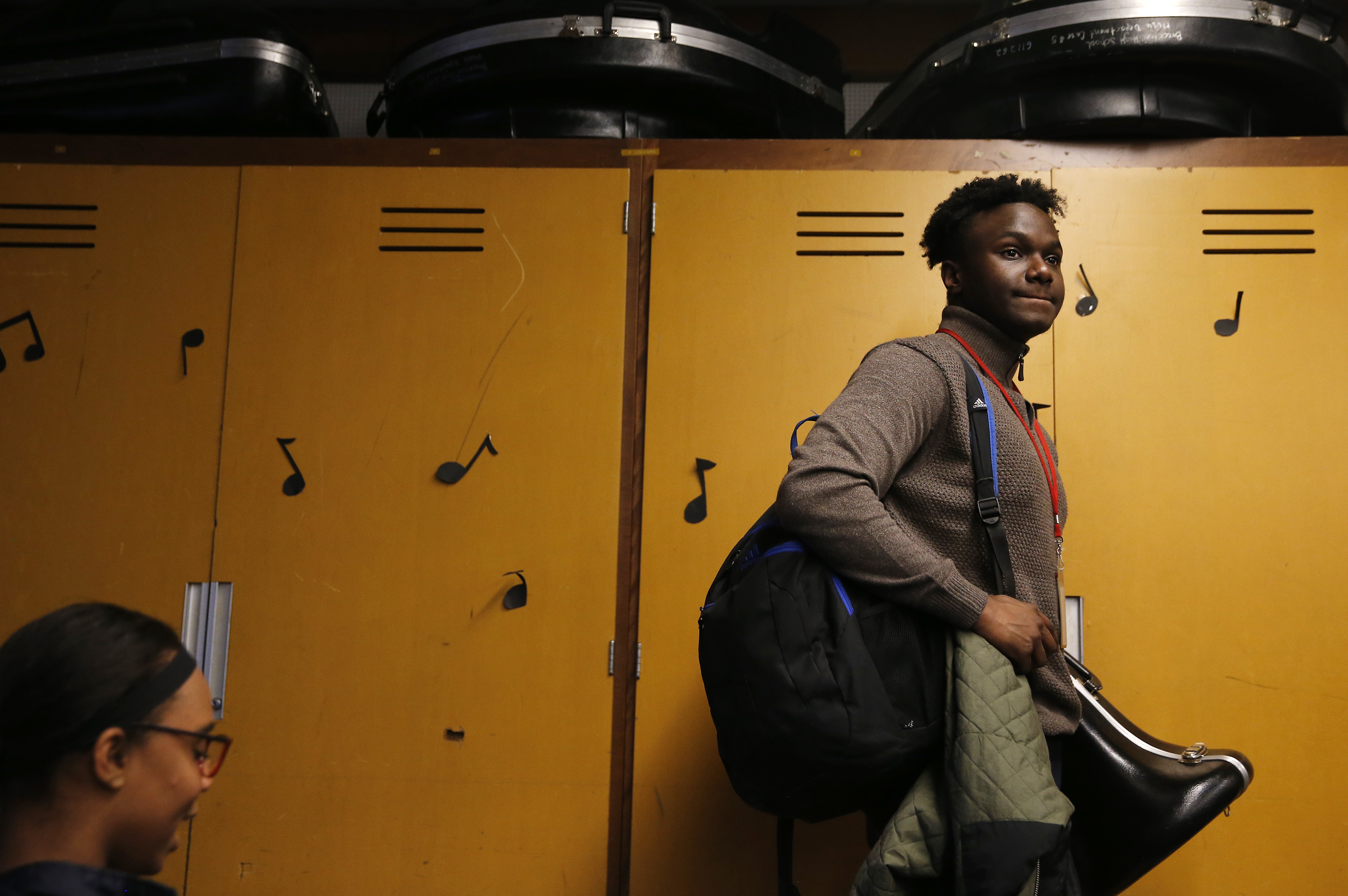 John Hyppolite, a junior who plays with the Brockton High School Advanced Concert Band, packs up his things after practice.