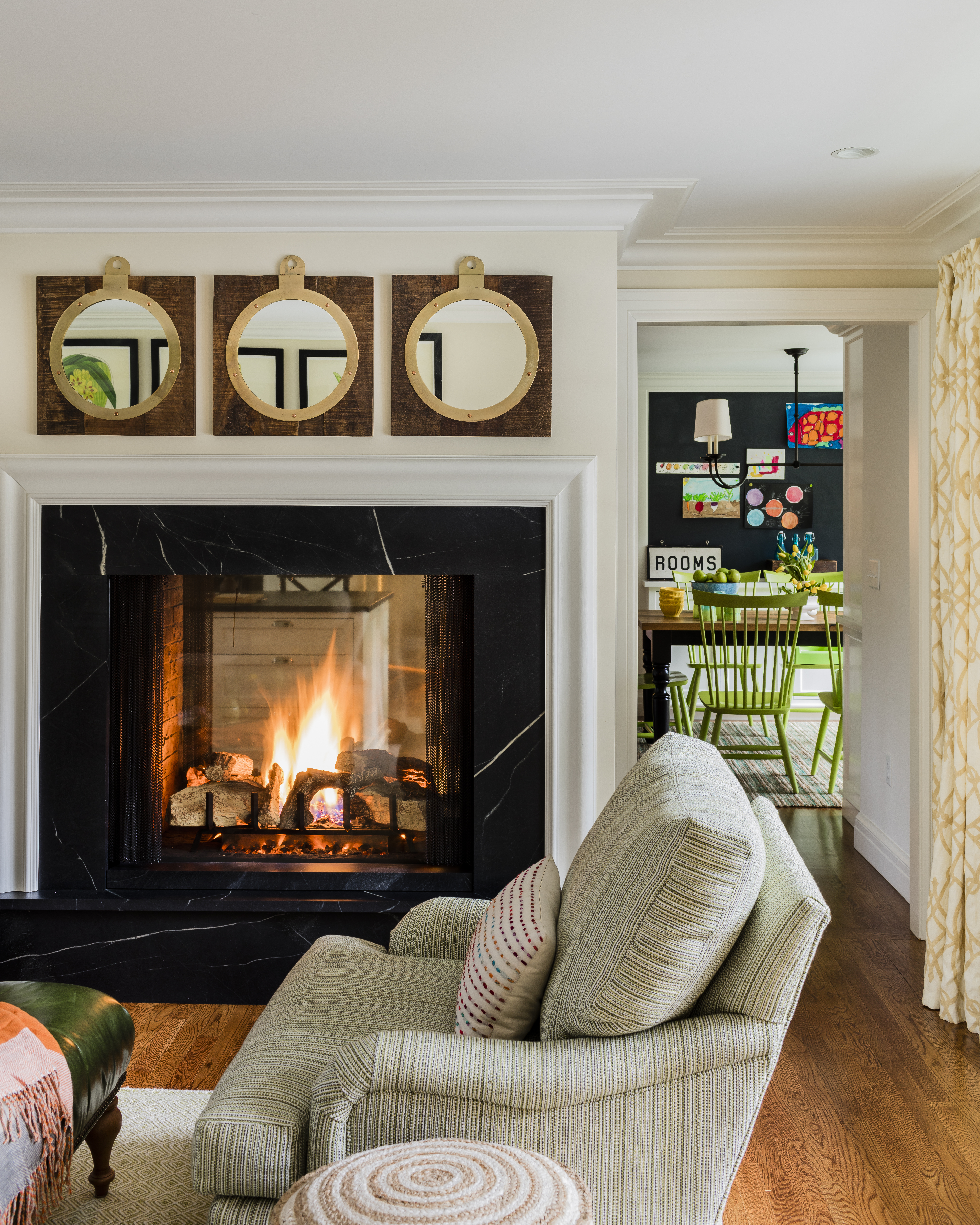 The new double-sided fireplace straddles the kitchen and family room.
