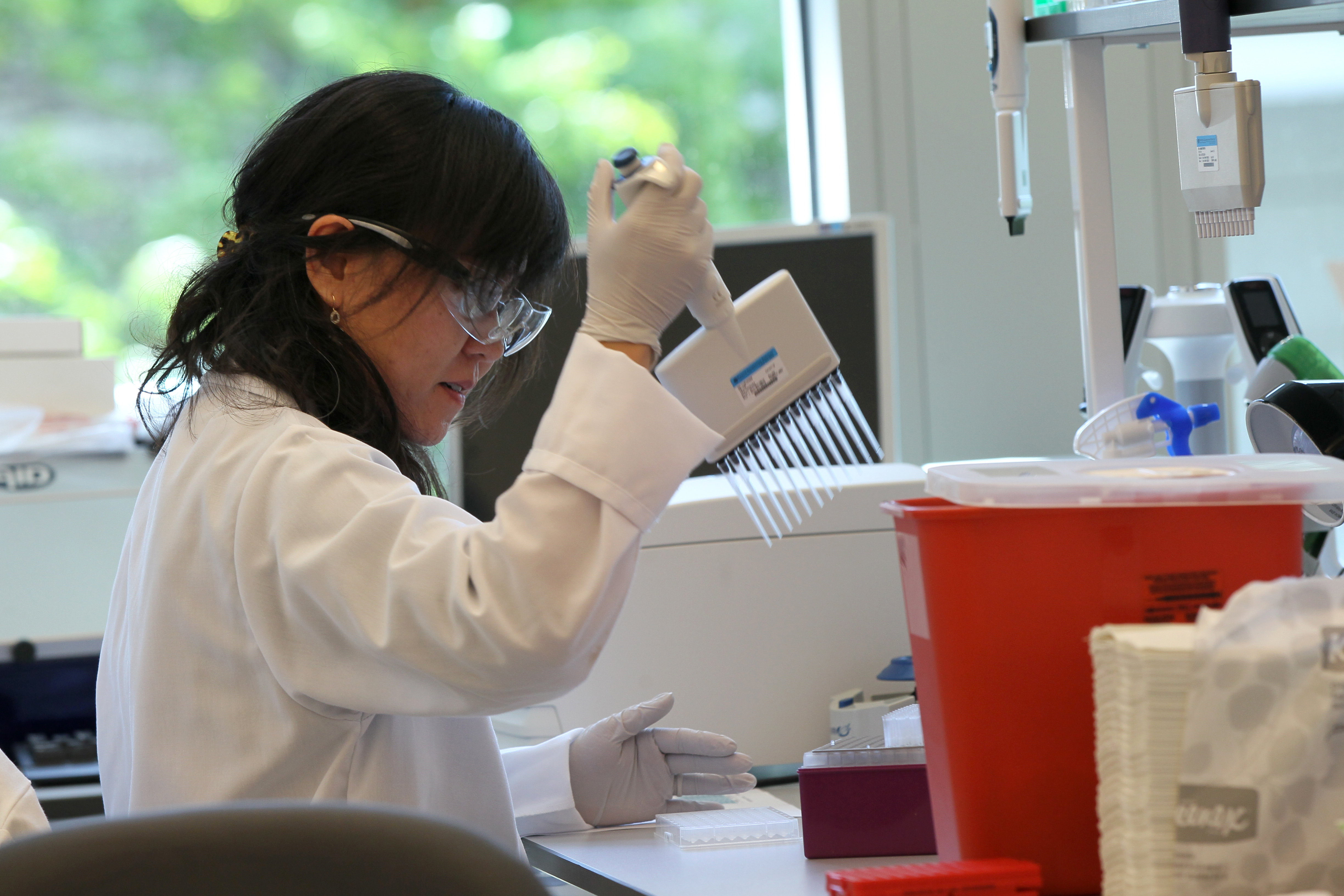 Scientist Li Li worked in the bright second-floor lab of the new Pfizer building in Kendall Square.
